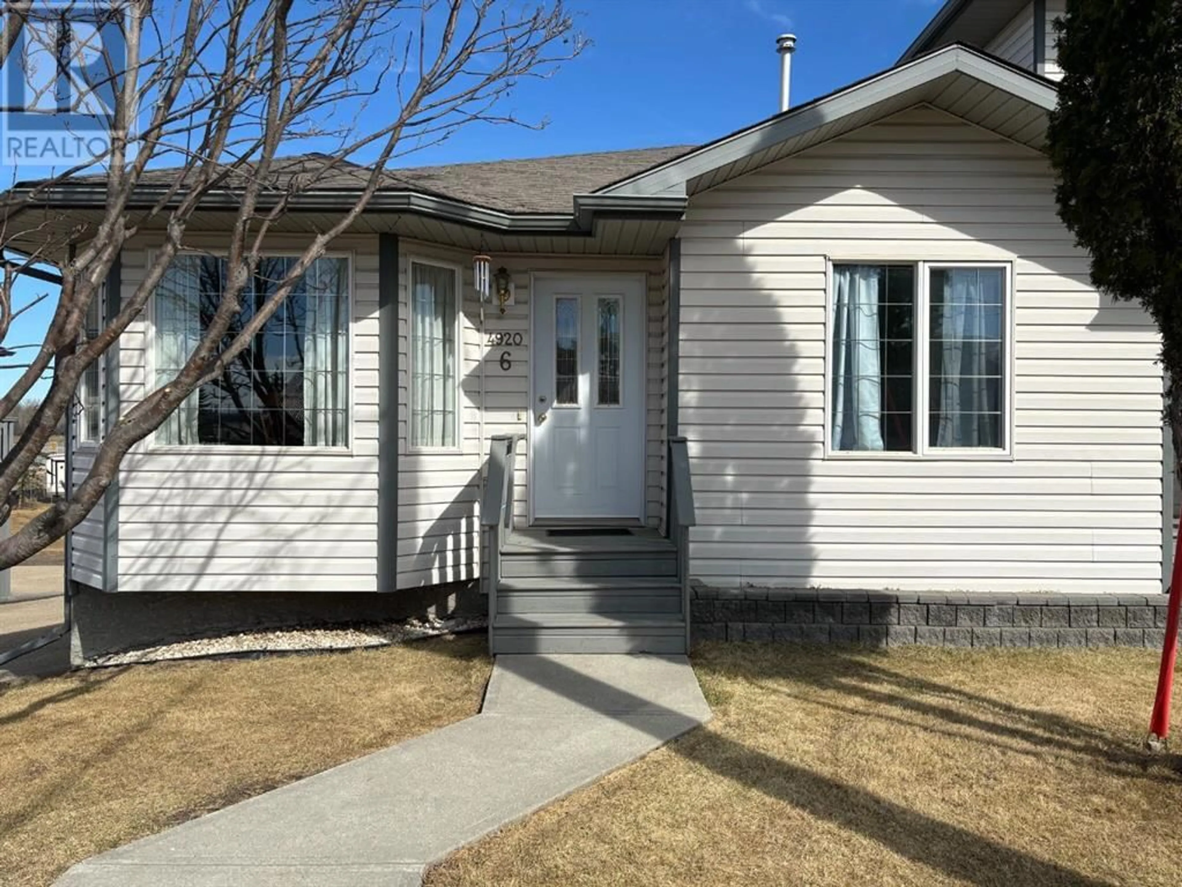 Frontside or backside of a home for UNIT 6 4920 53 Avenue, Whitecourt Alberta T7S1V4