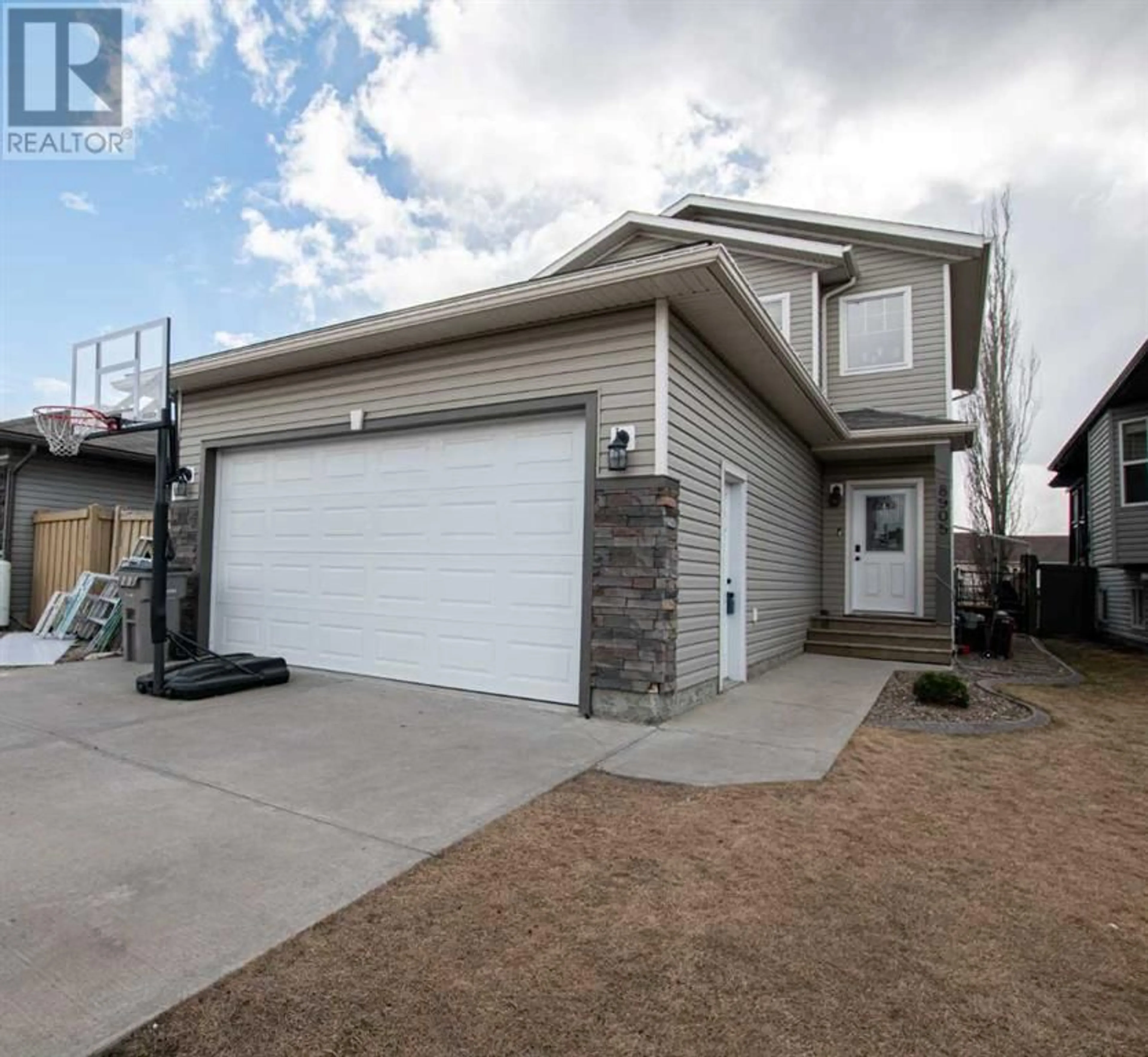Frontside or backside of a home for 8905 71 Avenue, Grande Prairie Alberta T8X0E1