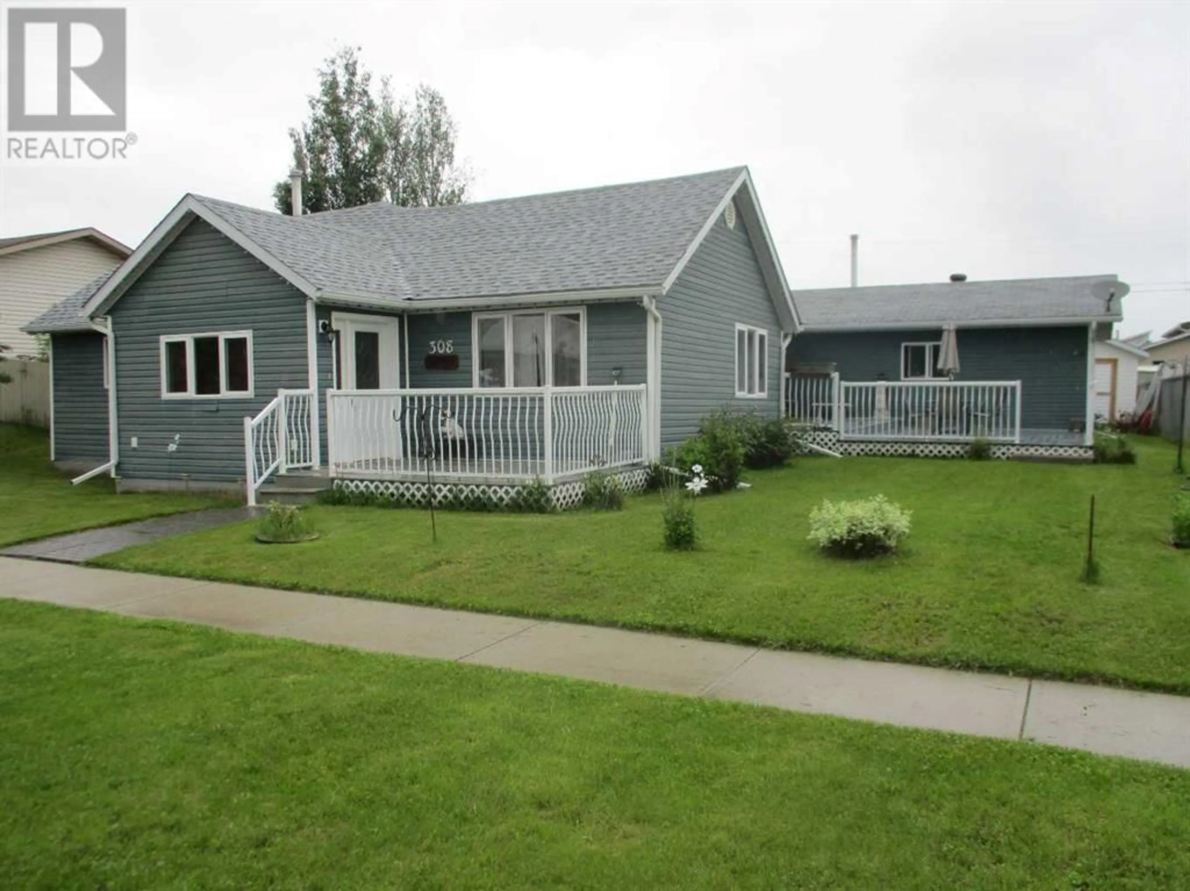 Frontside or backside of a home for #308 6th Avenue SE, Manning Alberta T0H2M0