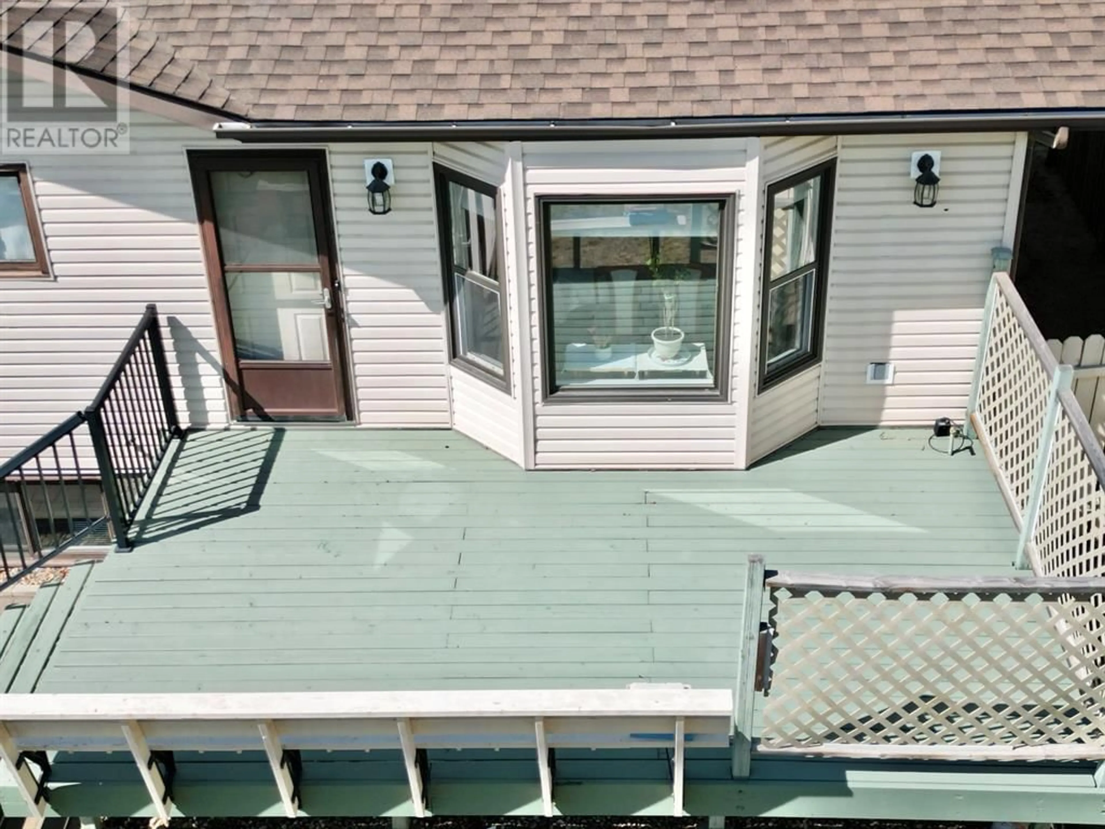 Home with vinyl exterior material for 10401 83 Street, Peace River Alberta T8S1X9