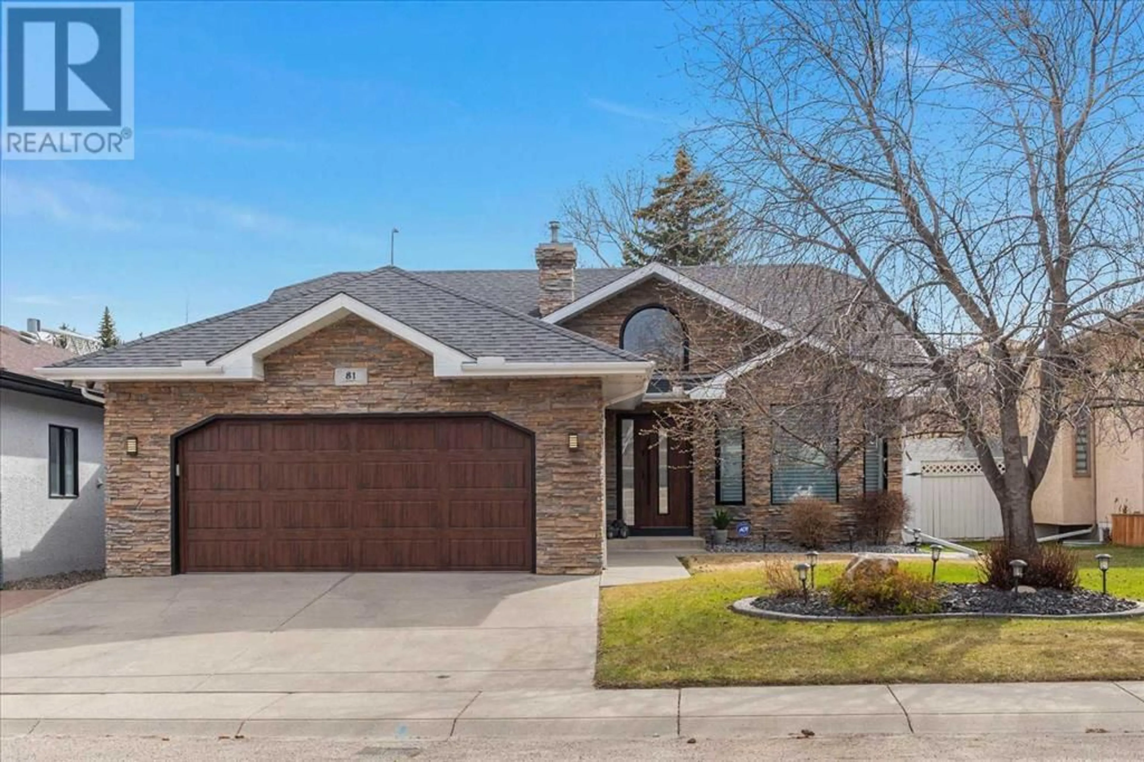 Home with brick exterior material for 81 Country Hills Close NW, Calgary Alberta T3K3Z2