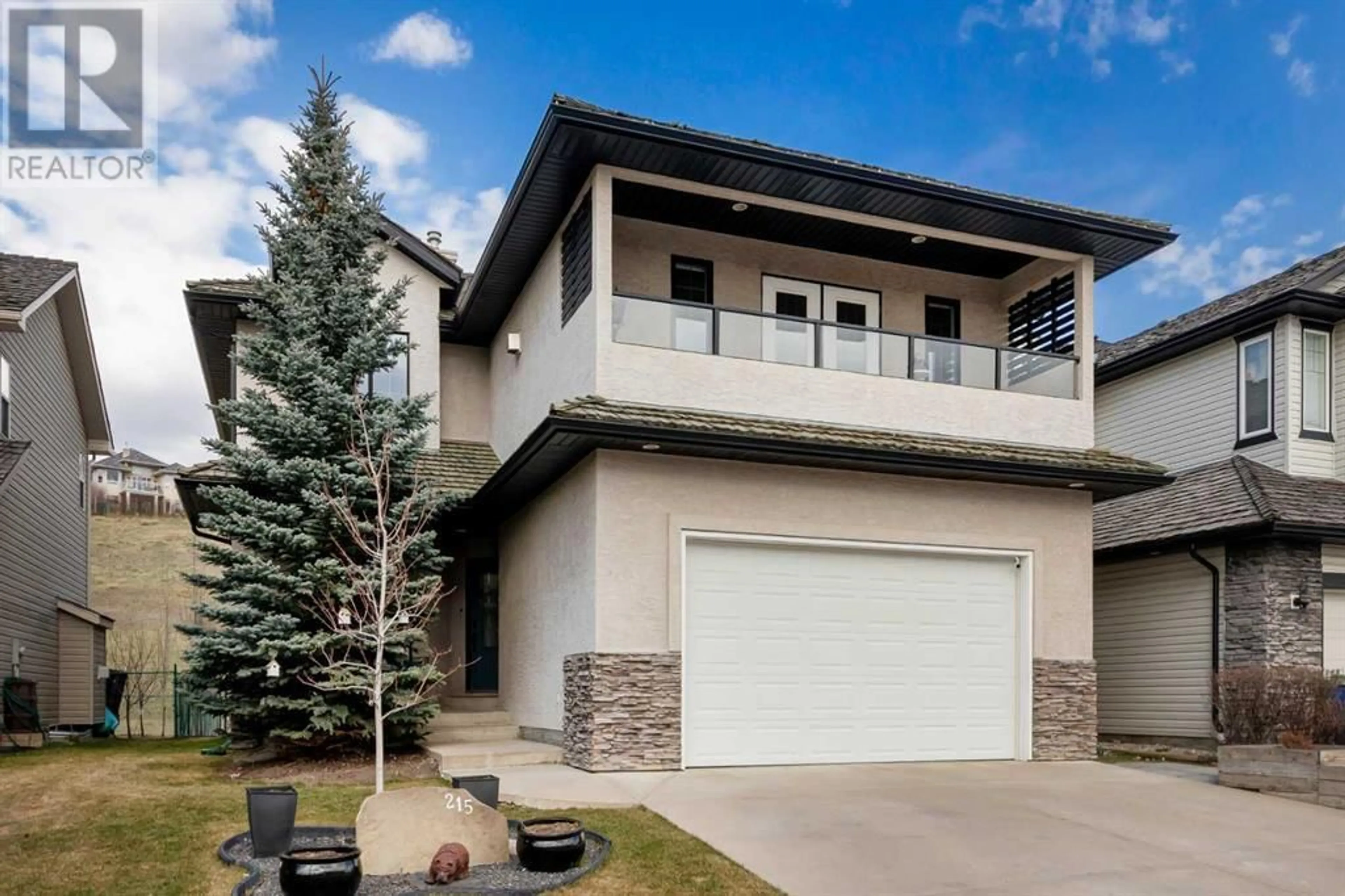 Frontside or backside of a home for 215 Gleneagles View, Cochrane Alberta T4C2G5