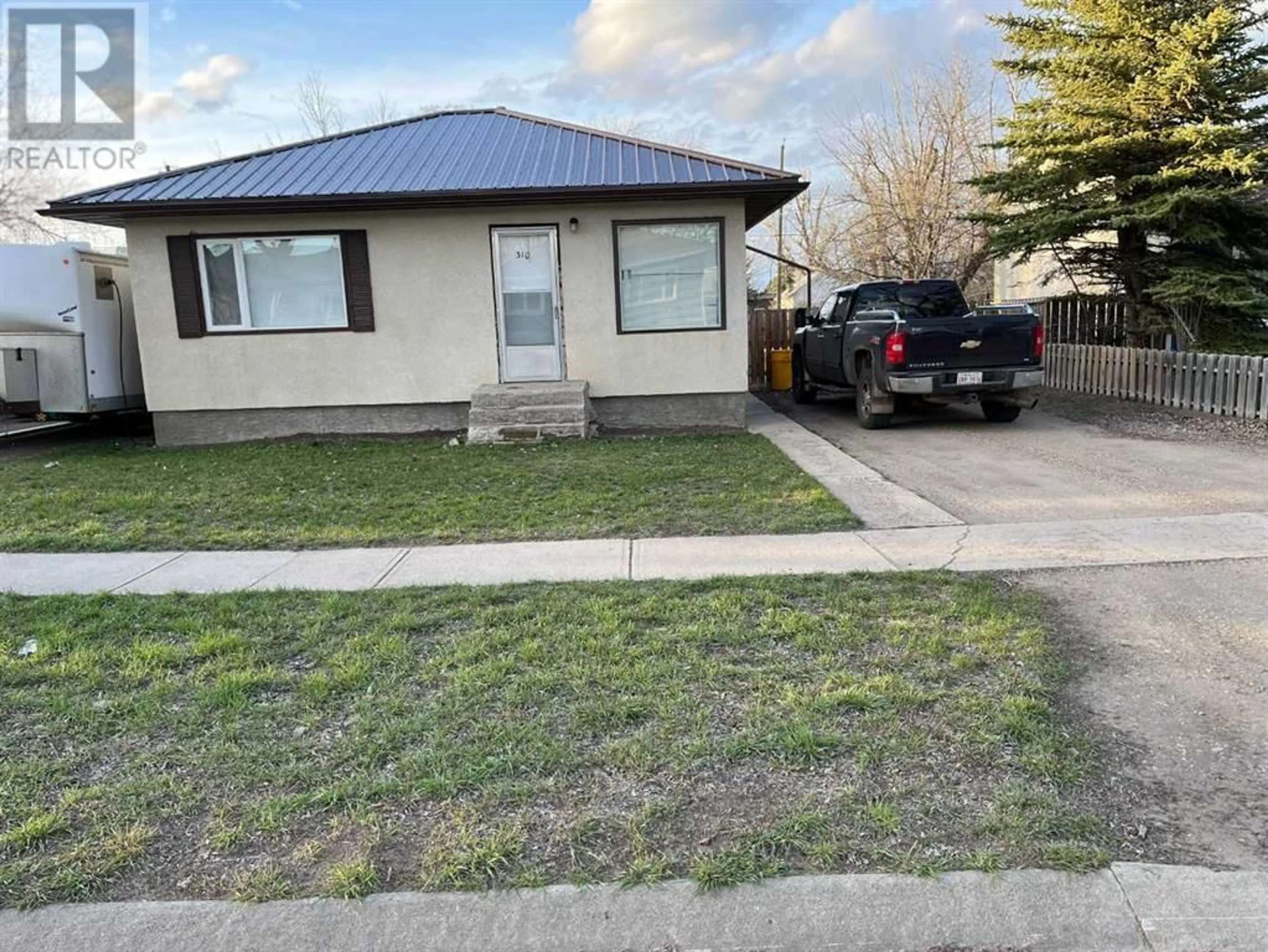 Frontside or backside of a home for 310 3rd Avenue E, Bow Island Alberta T0K0G0