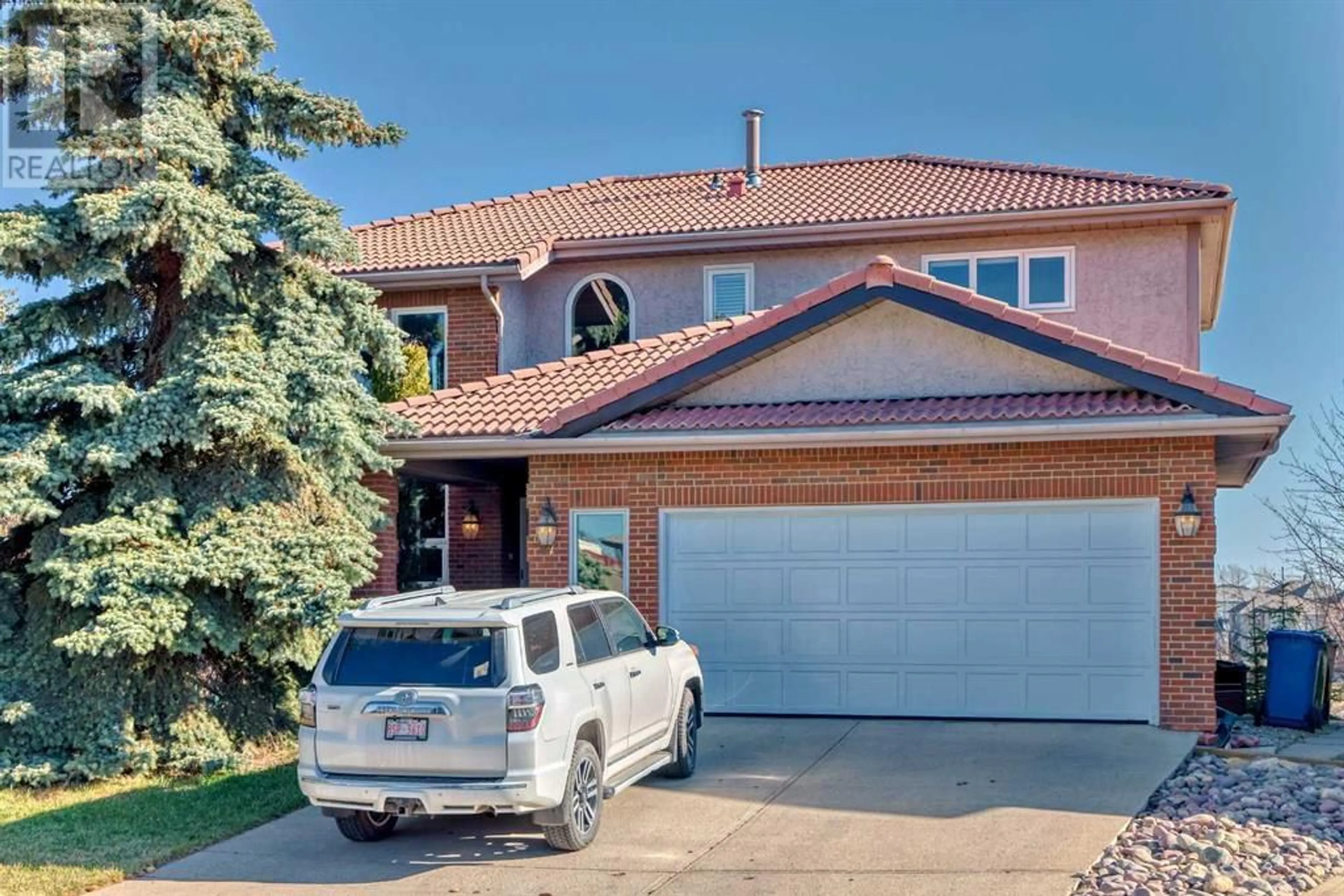Home with brick exterior material for 47 Edgeridge Court NW, Calgary Alberta T3A4P1