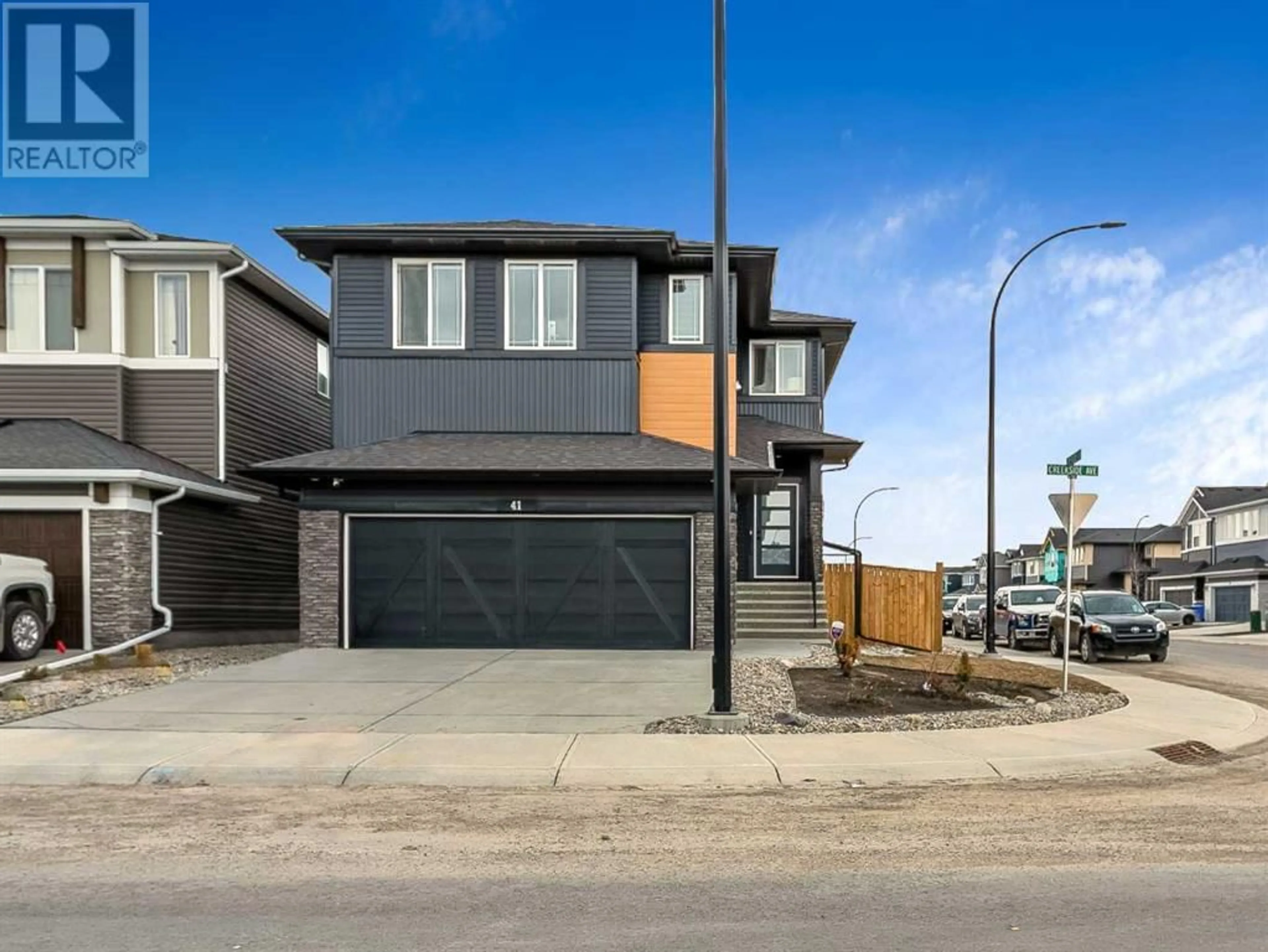 Frontside or backside of a home for 41 Creekside Avenue SW, Calgary Alberta T2X4A9