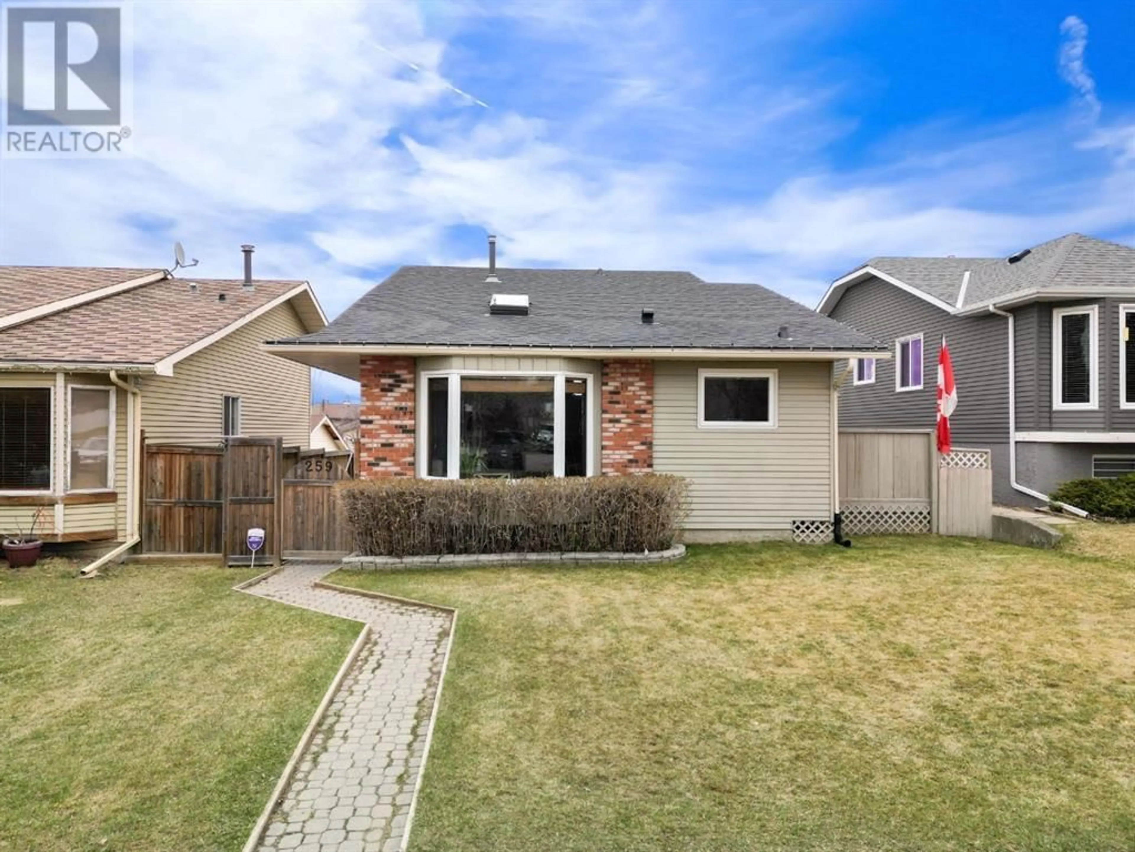 Frontside or backside of a home for 259 Sandstone Road NW, Calgary Alberta T3K2Z1