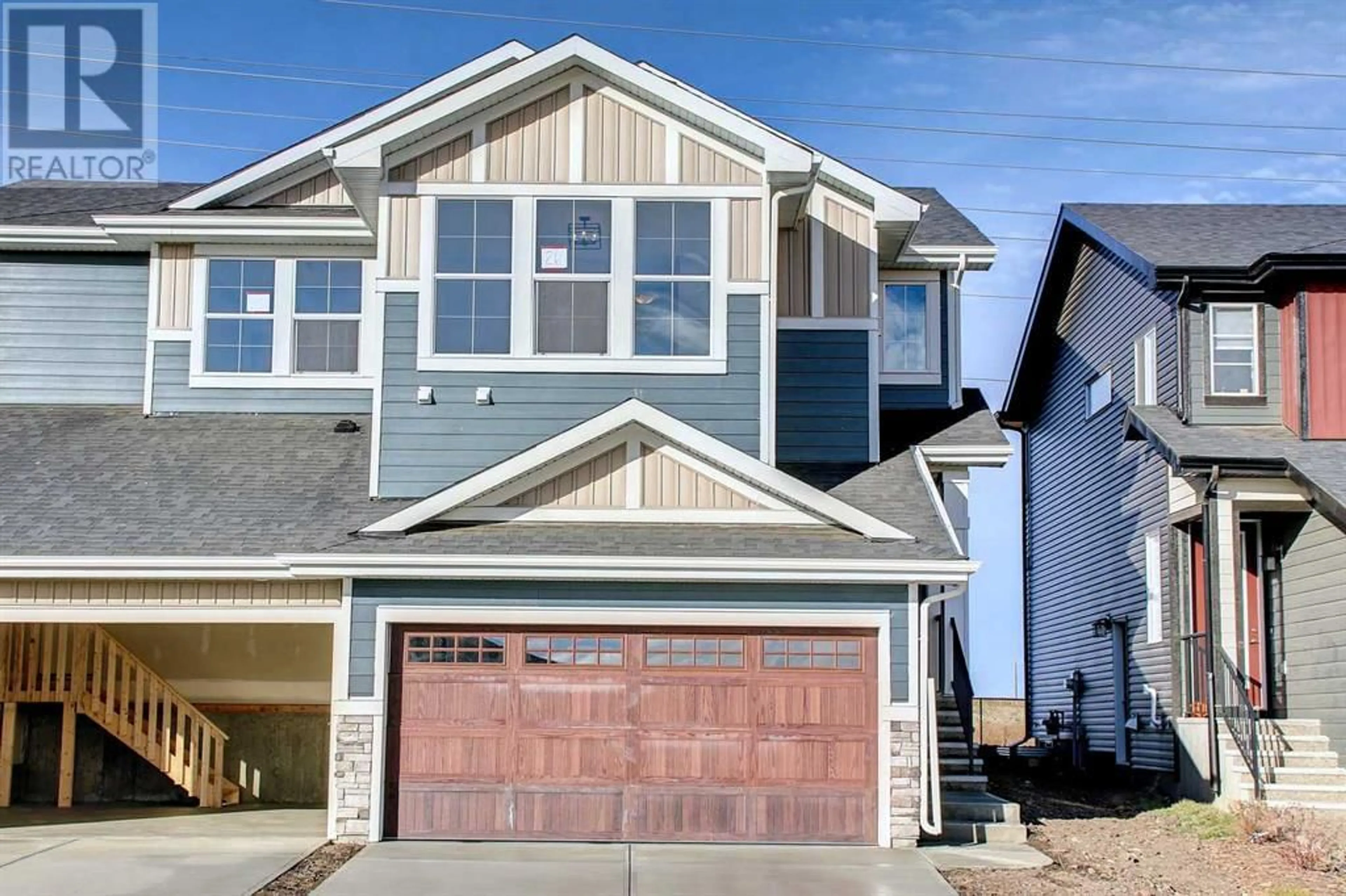 Home with vinyl exterior material for 60 Mill Road, Cochrane Alberta T4C3G7