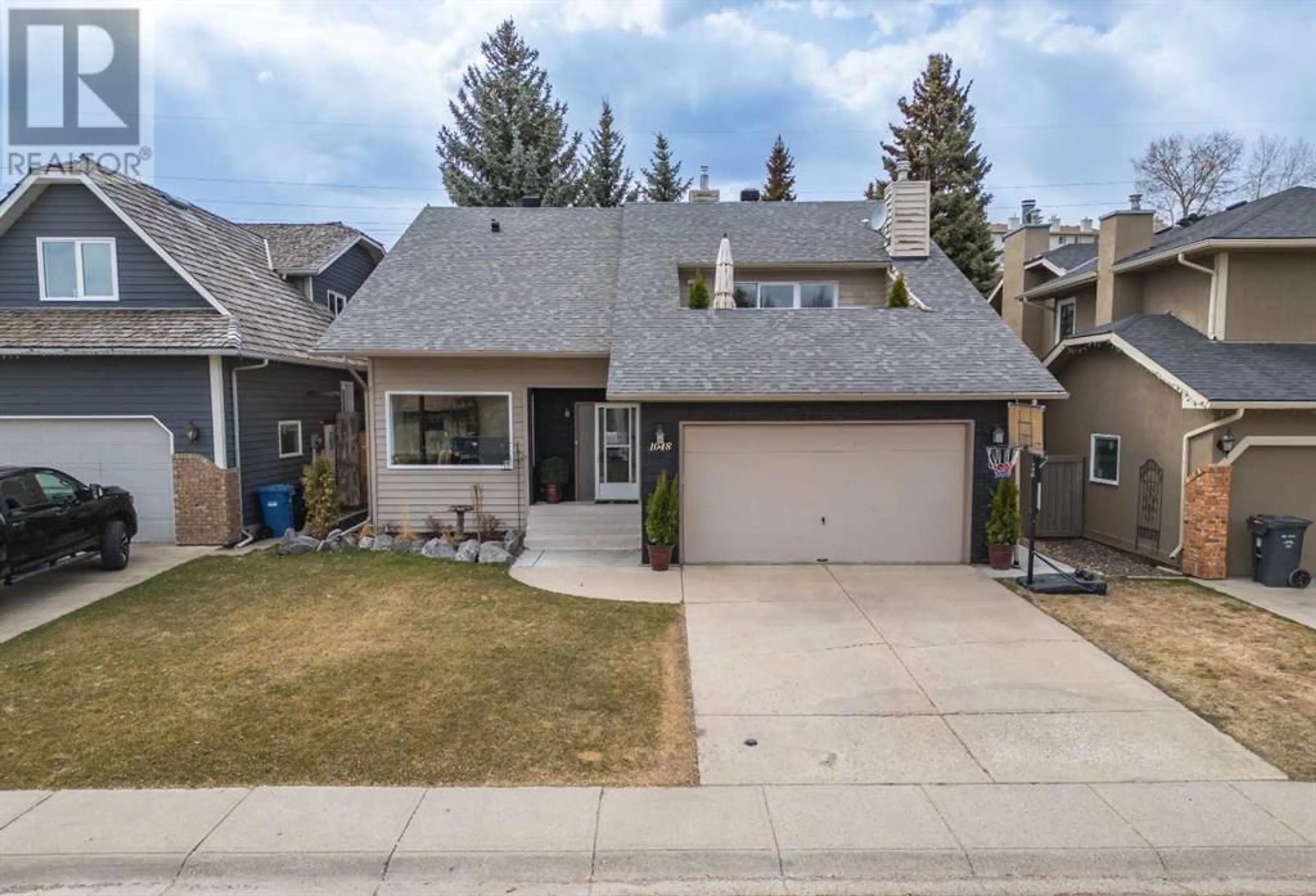 Frontside or backside of a home for 1048 Deer River Circle SE, Calgary Alberta T2J6Y9