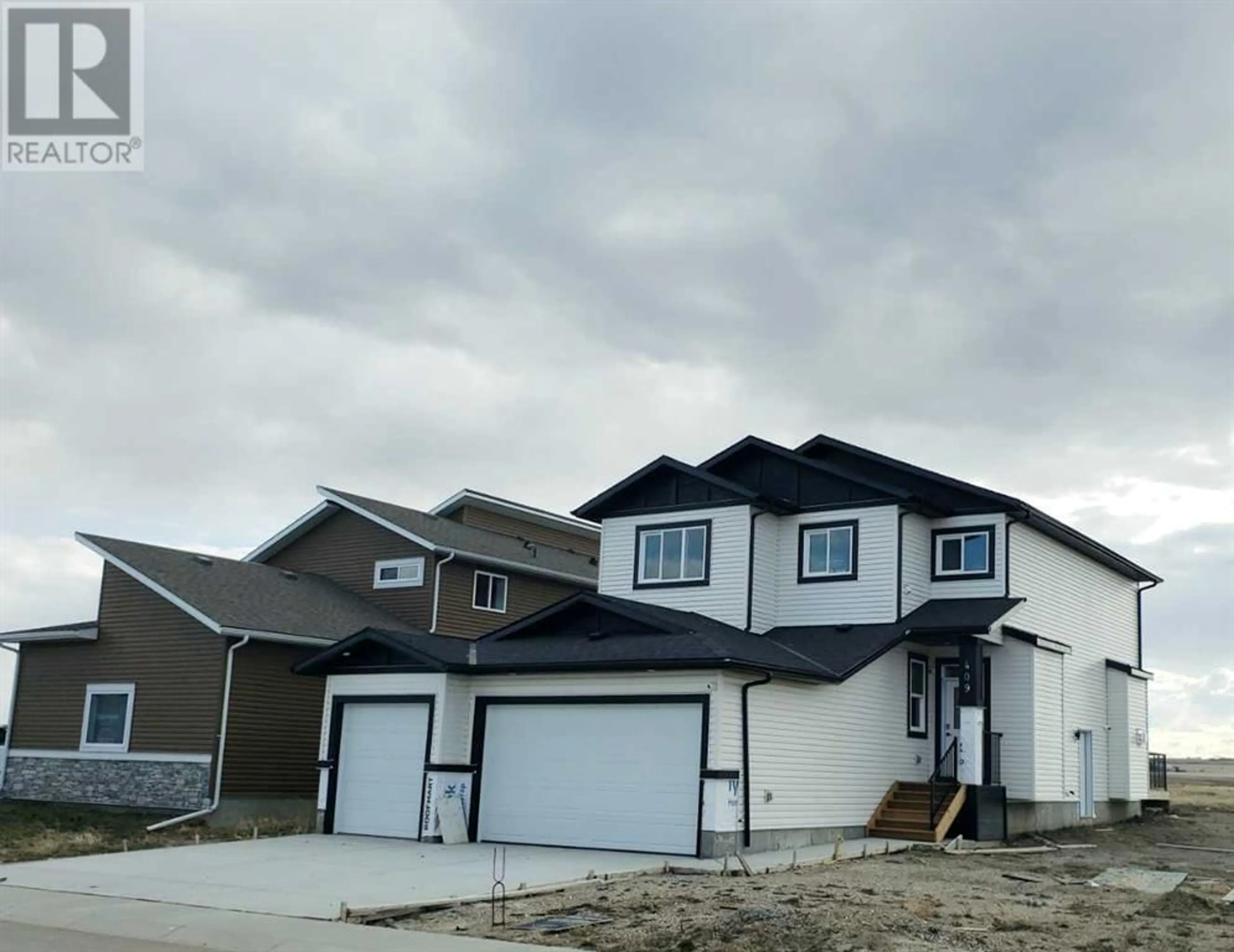 Frontside or backside of a home for 1409 Aldrich Place, Carstairs Alberta T0M0N0