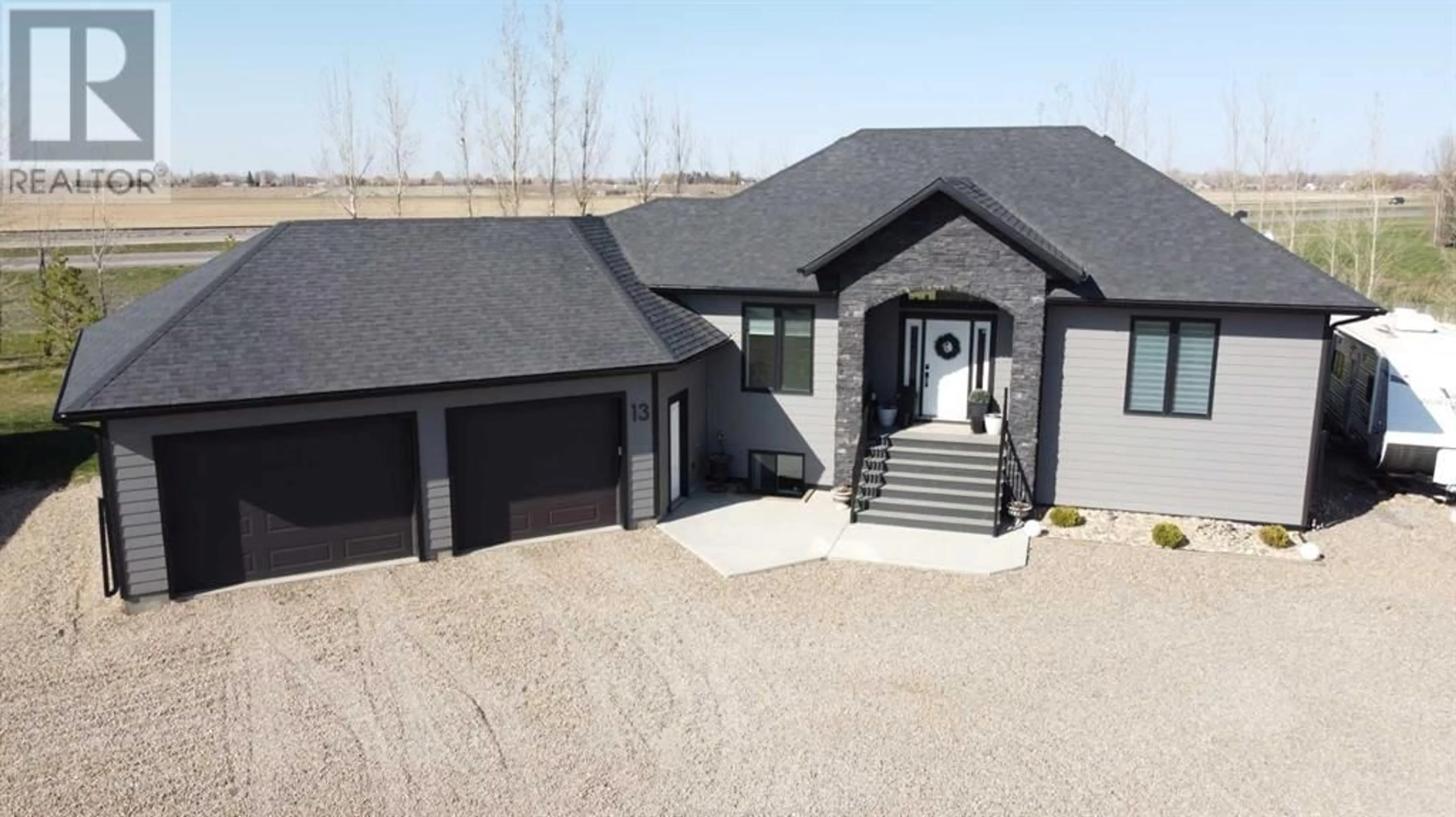 Frontside or backside of a home for 13 Grasslands Road, Rural Taber, M.D. of Alberta T1G2C8