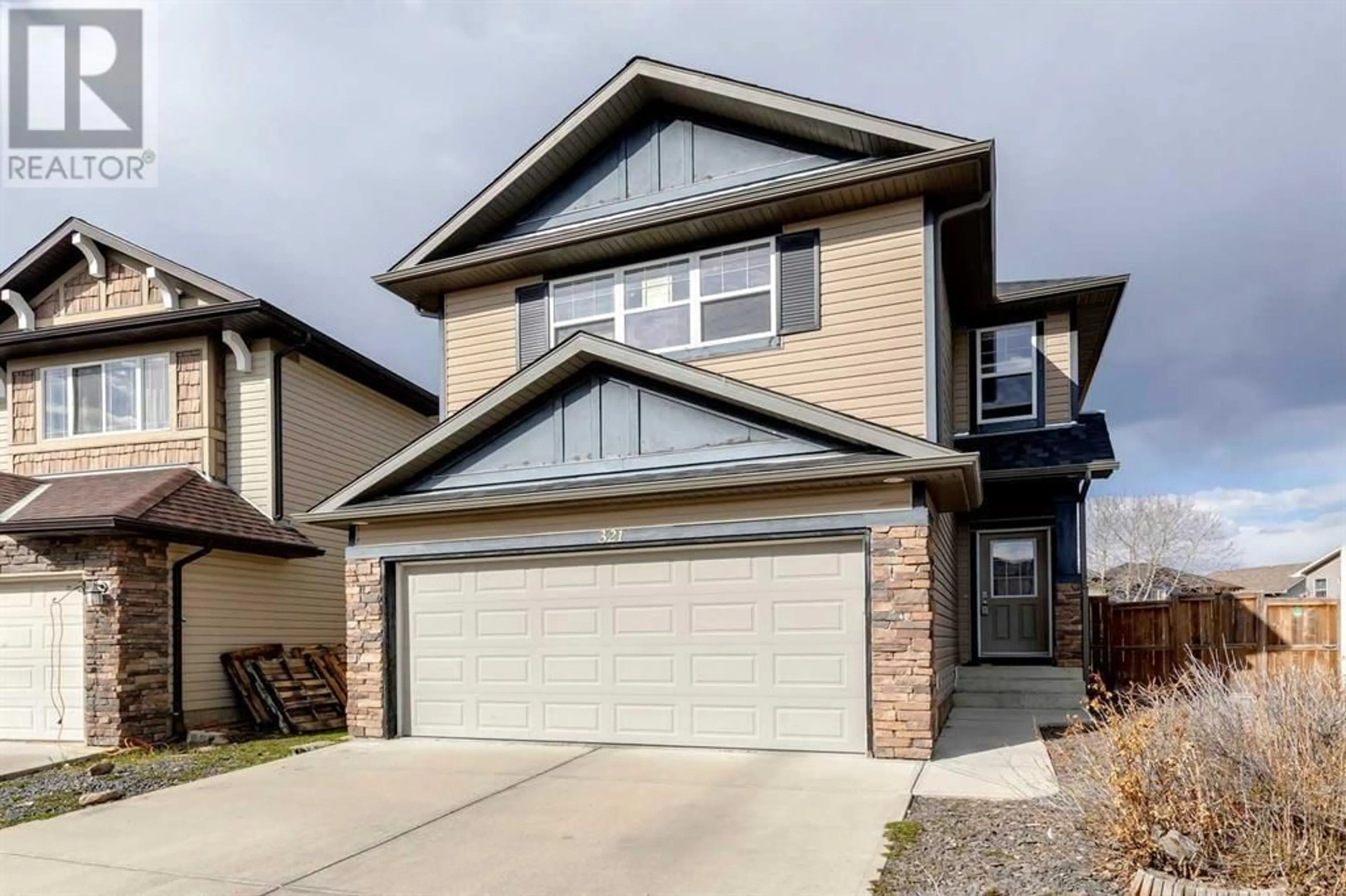 Frontside or backside of a home for 321 Bridleridge View SW, Calgary Alberta T2Y0E6