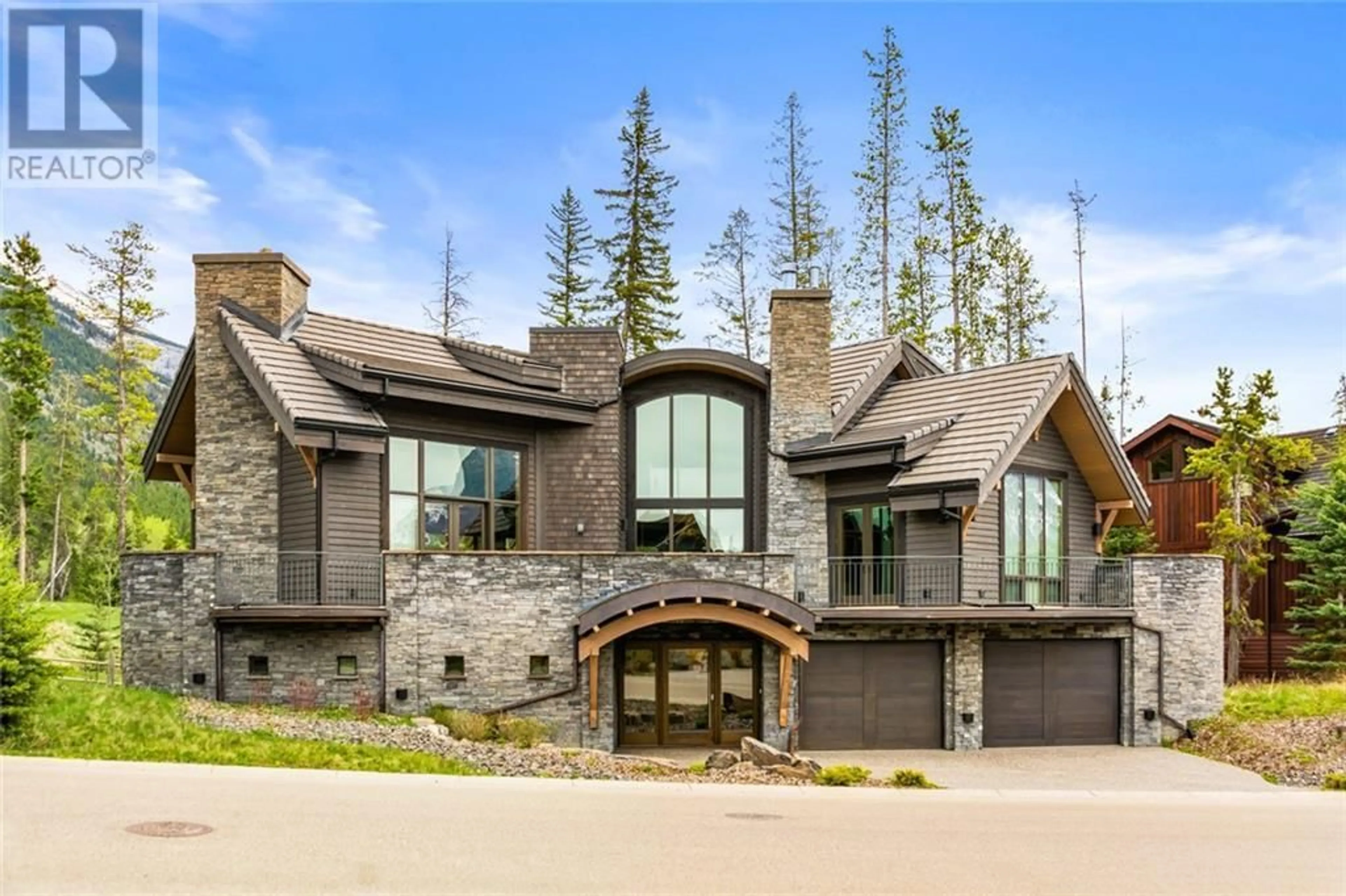Frontside or backside of a home for 600 Silvertip Road, Canmore Alberta T1W3K8
