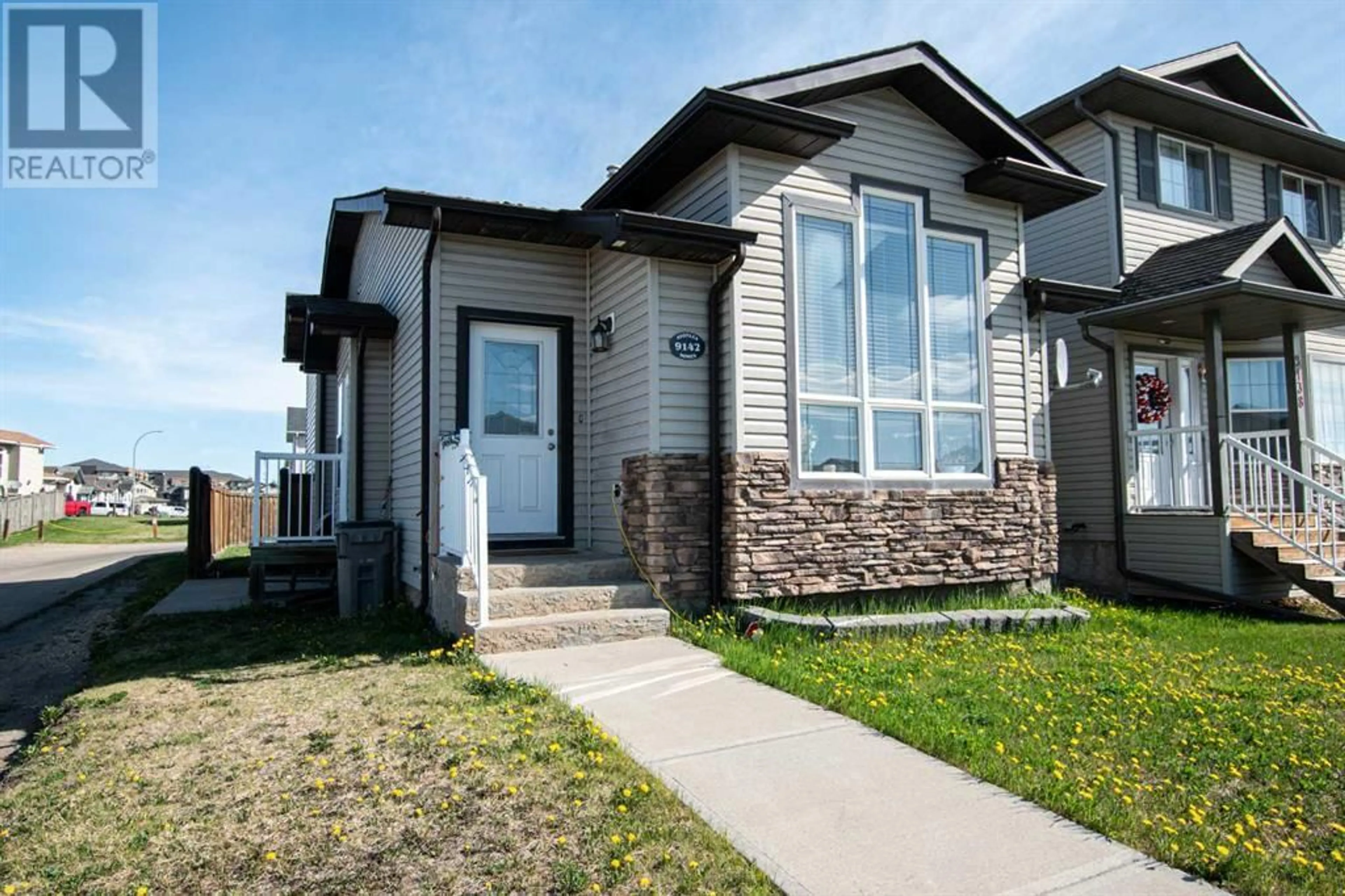 Frontside or backside of a home for 9142 94 Avenue, Grande Prairie Alberta T8X0C7