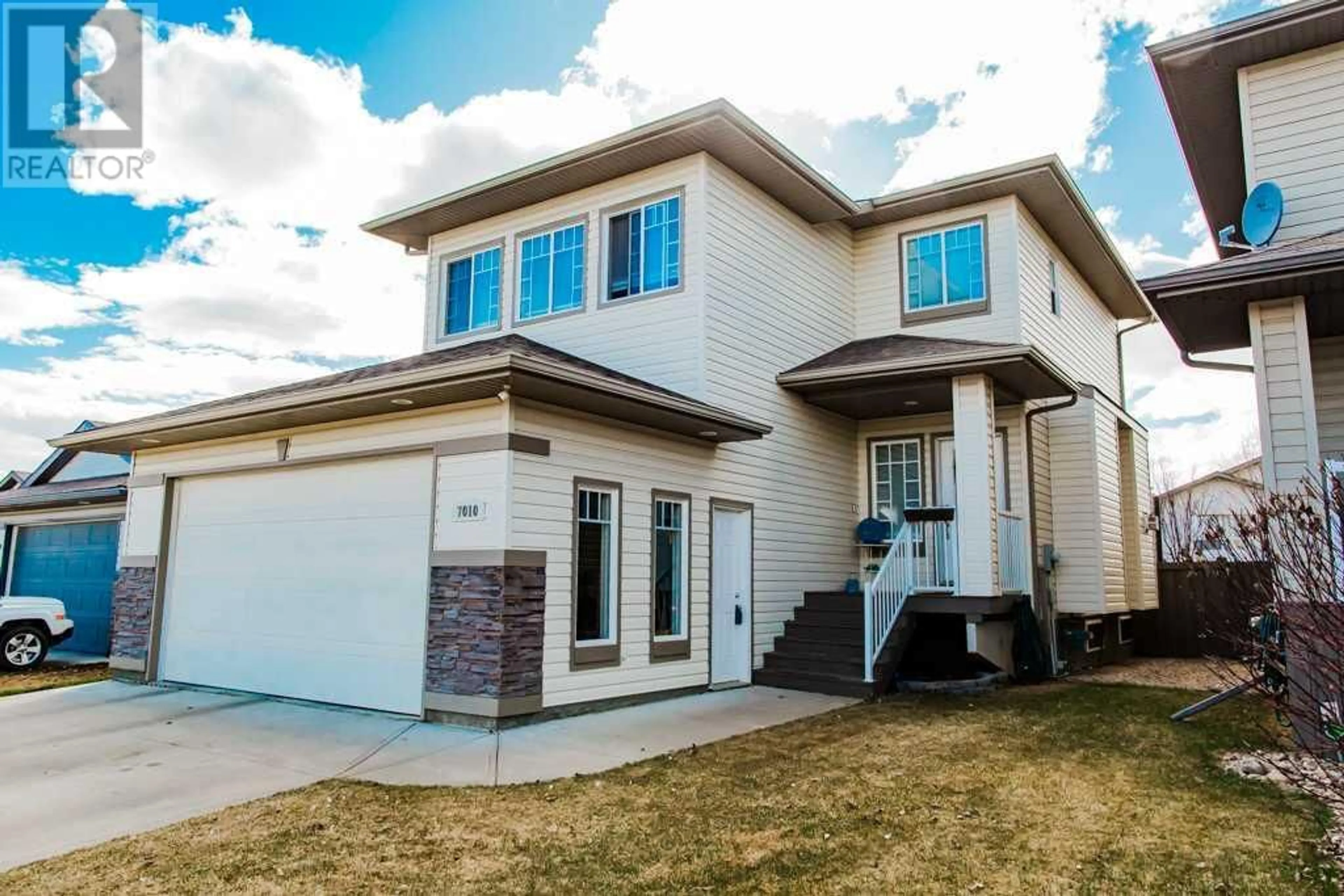 Home with vinyl exterior material for 7010 86 Street, Grande Prairie Alberta T8X0C8
