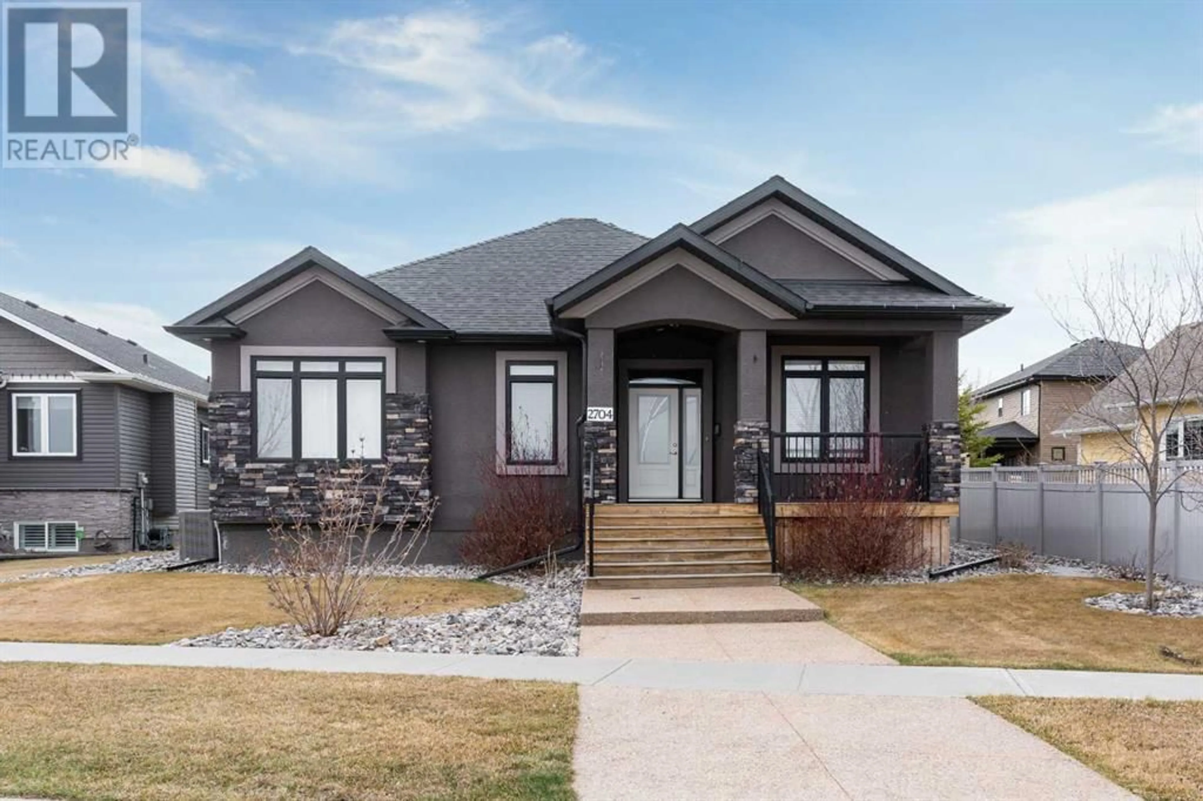 Frontside or backside of a home for 2704 62 Street, Camrose Alberta T4V5J5