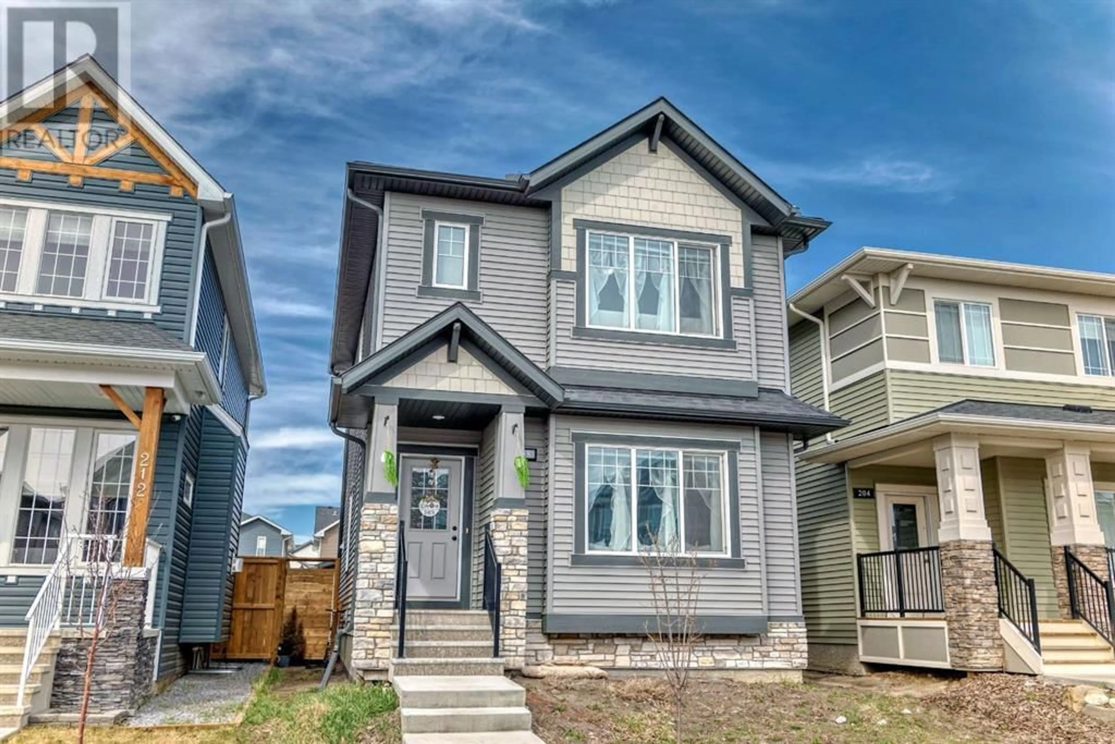 Frontside or backside of a home for 208 Ravenstern Crescent SE, Airdrie Alberta T4A0W3