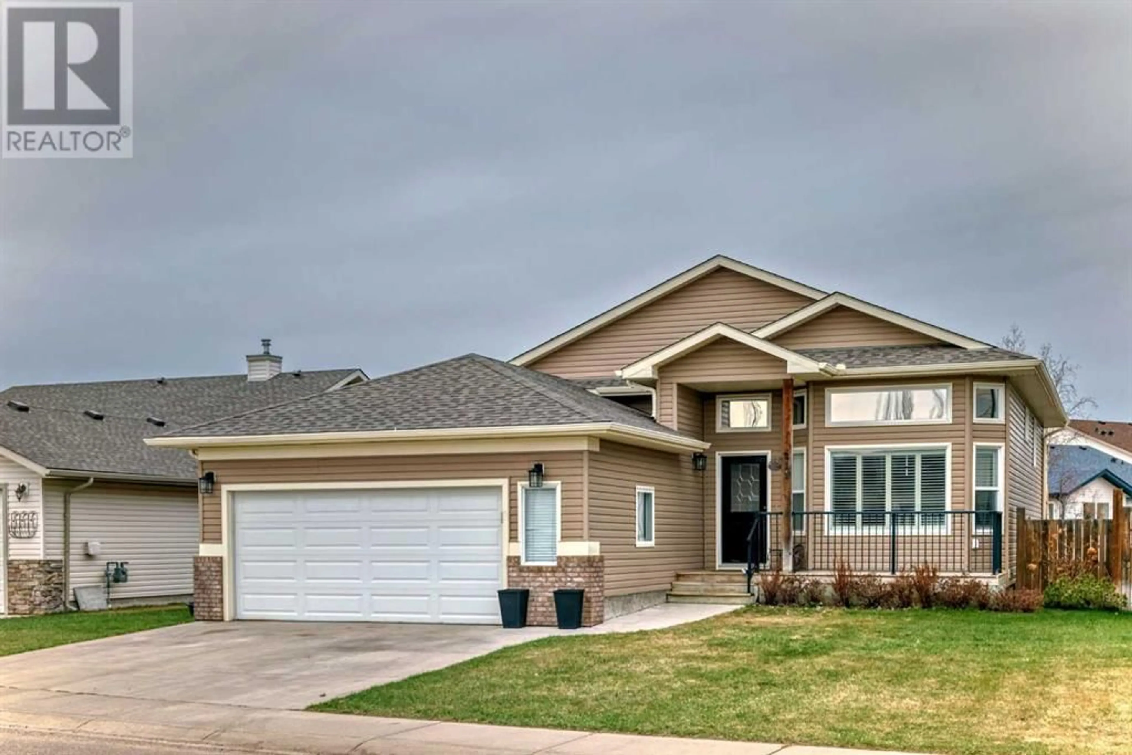 Frontside or backside of a home for 211 Hillcrest Boulevard, Strathmore Alberta t1p0a3