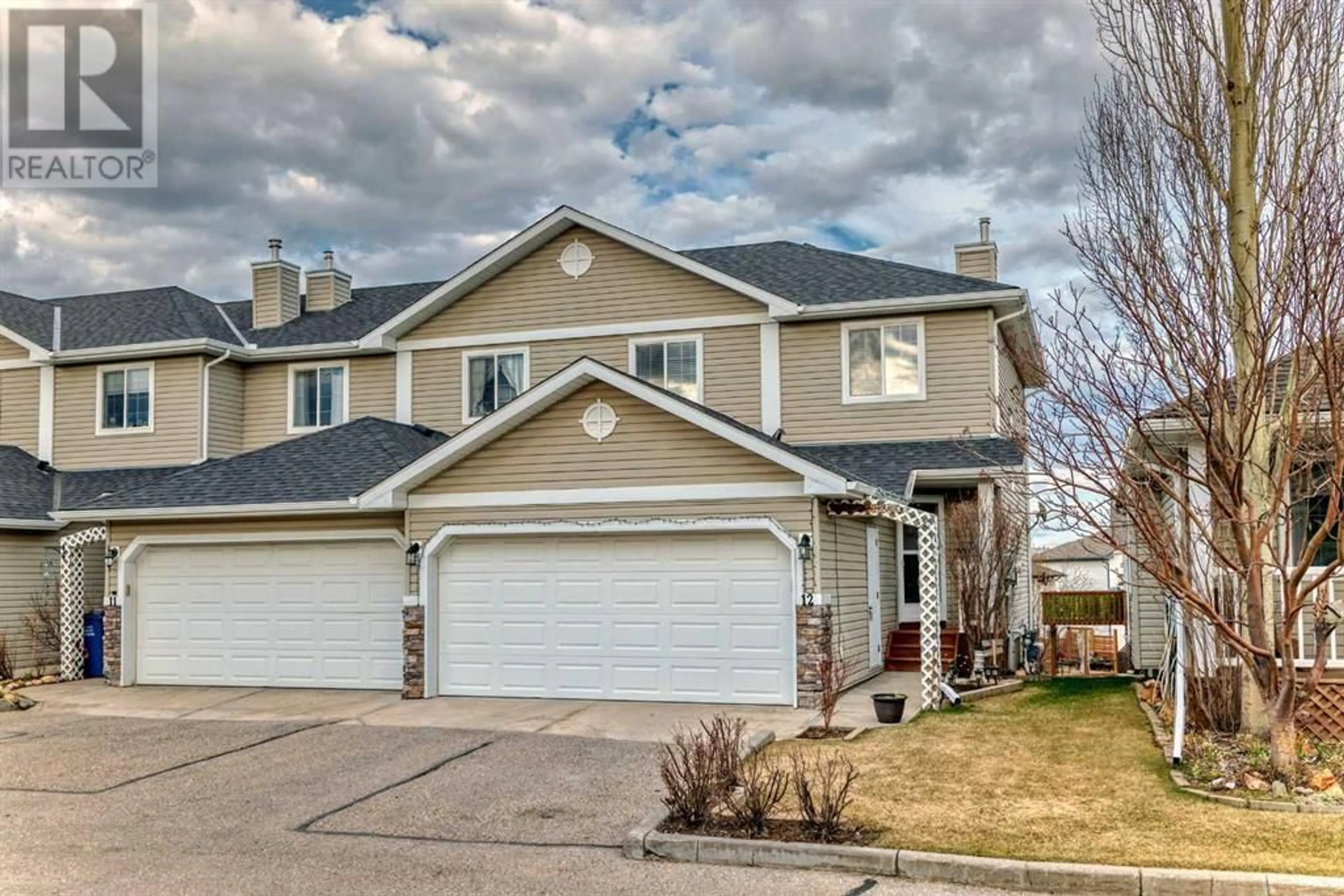 A pic from exterior of the house or condo for 12 117 Bow Ridge Drive, Cochrane Alberta T4C2G9