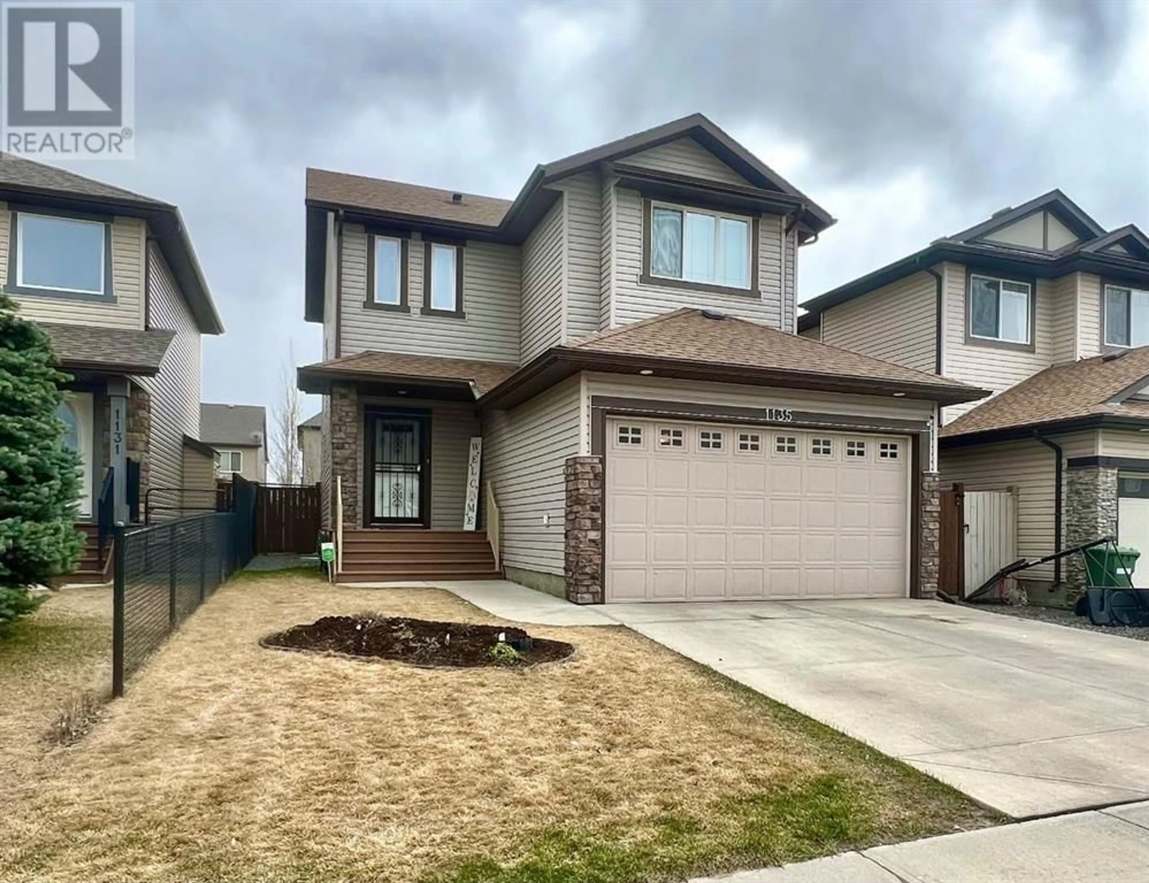 Frontside or backside of a home for 1135 Prairie Springs Hill SW, Airdrie Alberta T4B0E6