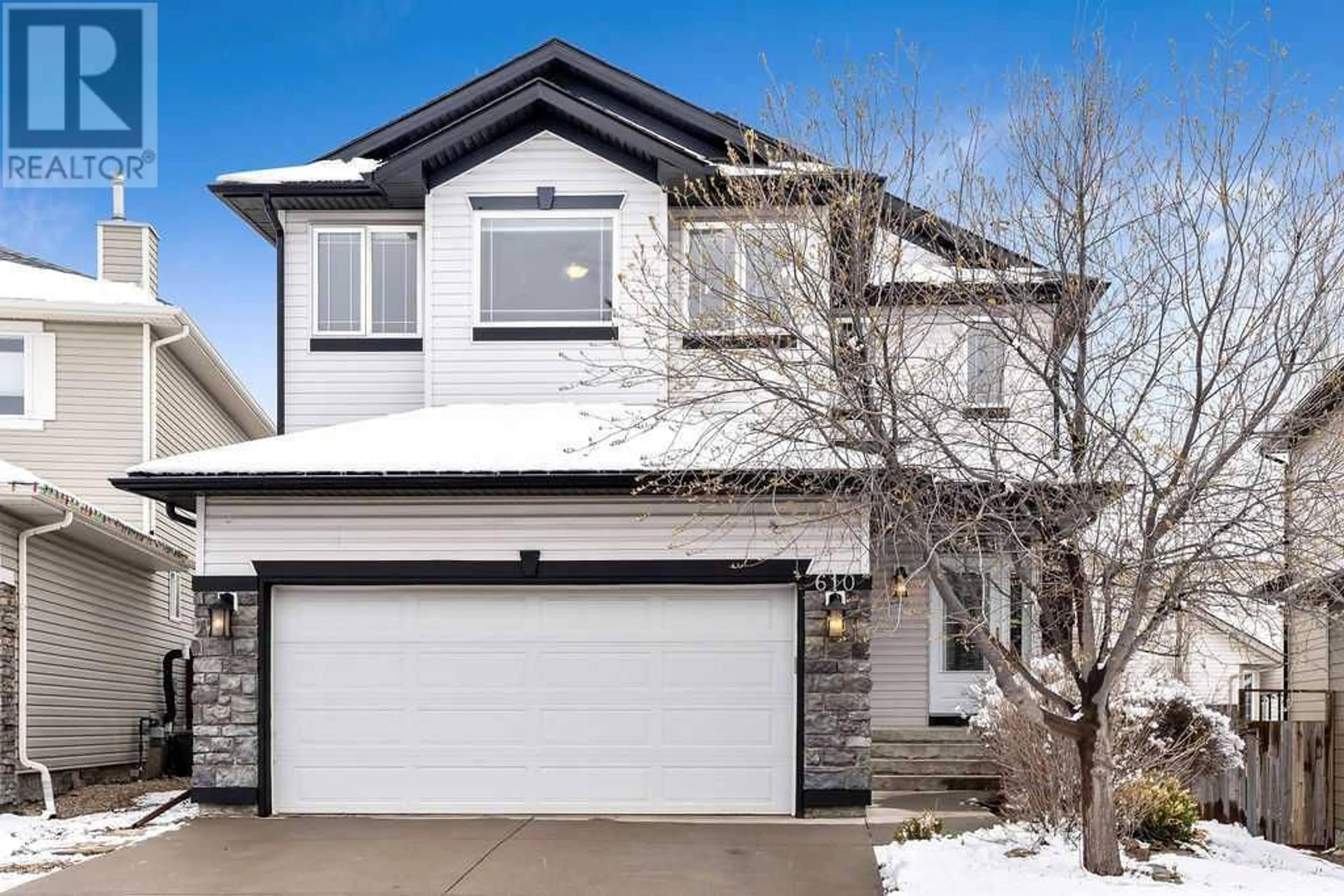 Frontside or backside of a home for 610 Rocky Ridge View NW, Calgary Alberta T3G5C2