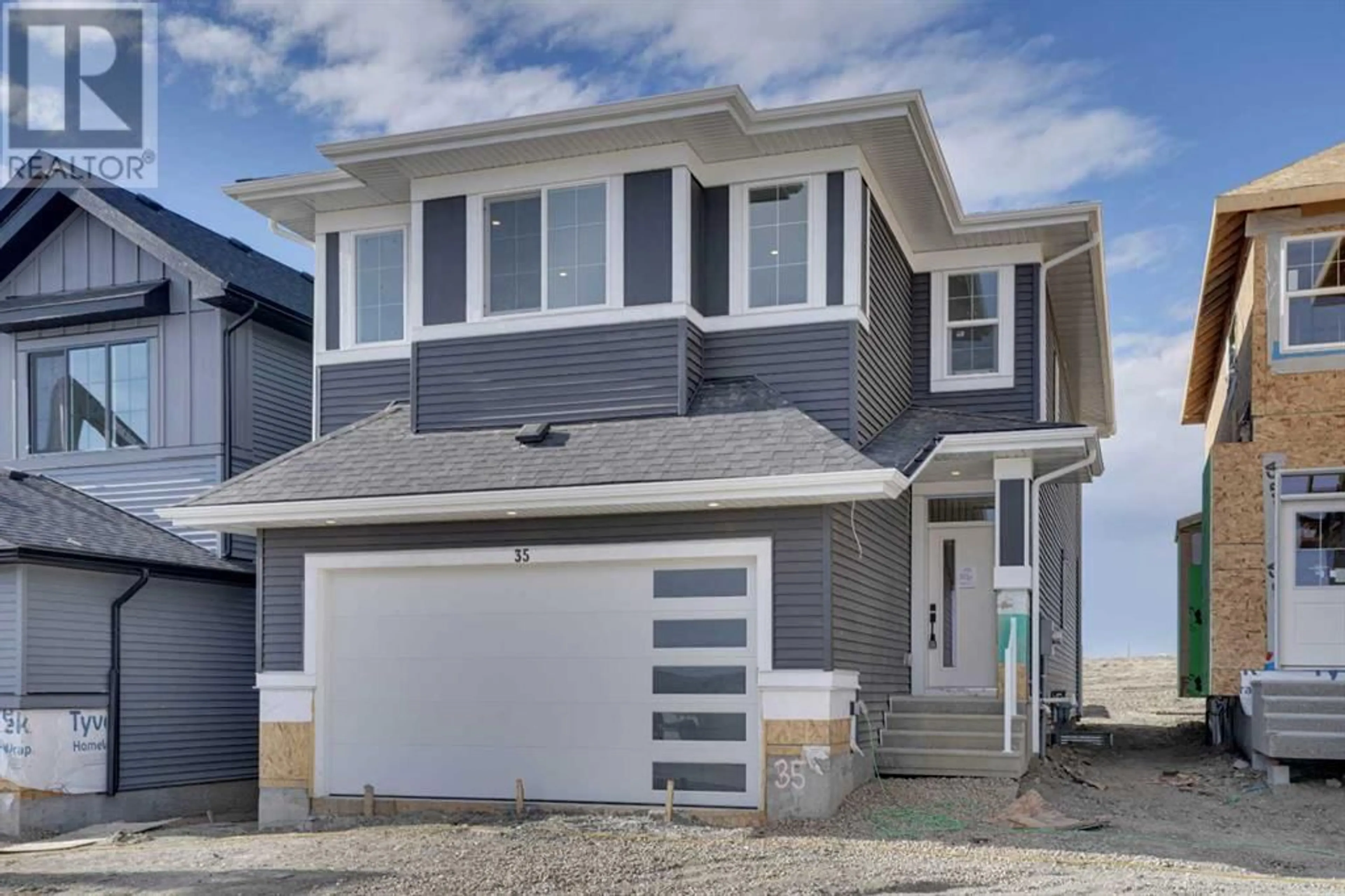 Frontside or backside of a home for 35 Heritage Circle, Cochrane Alberta T4C3G9