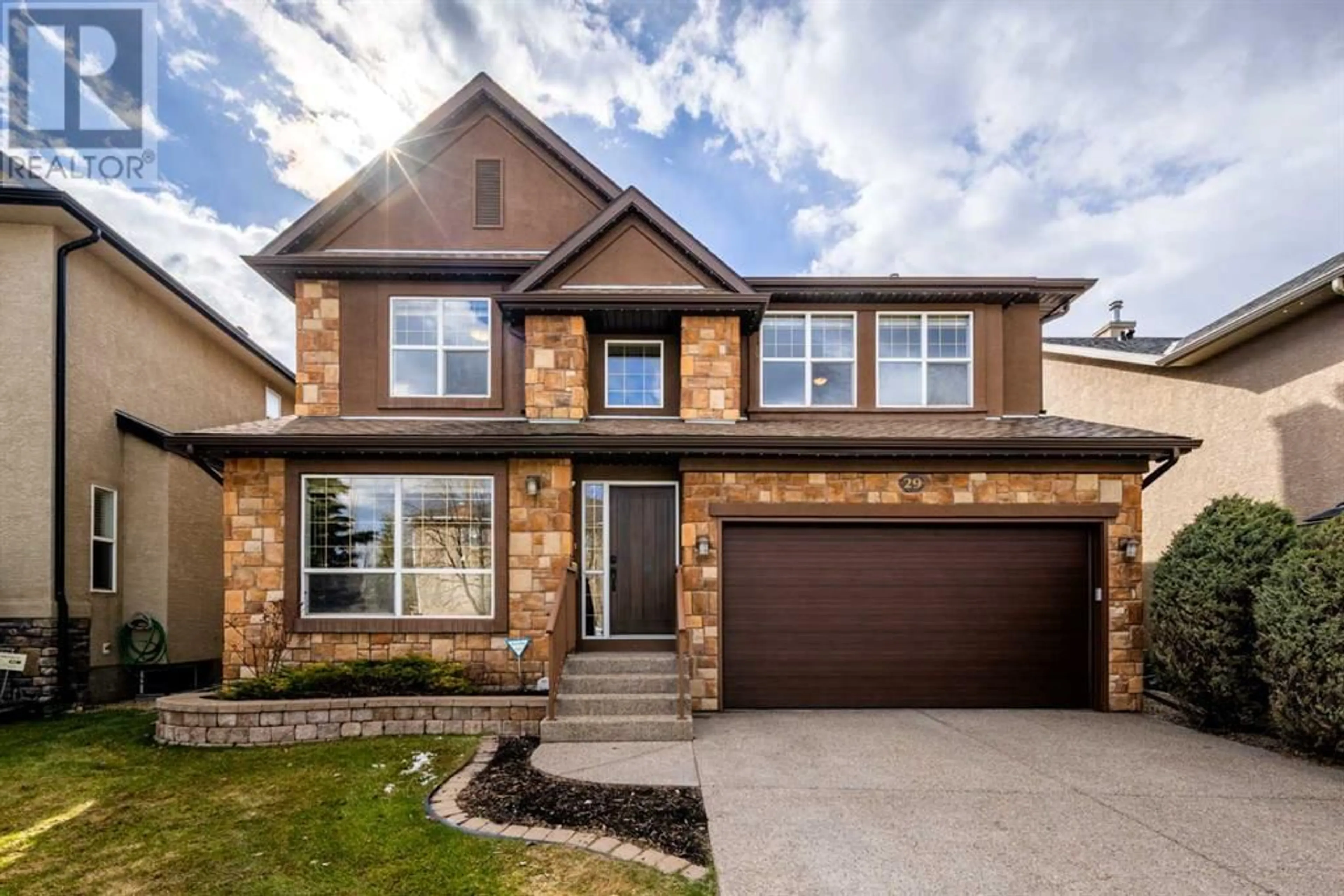 Home with brick exterior material for 29 Strathlea Court SW, Calgary Alberta T3H4R8