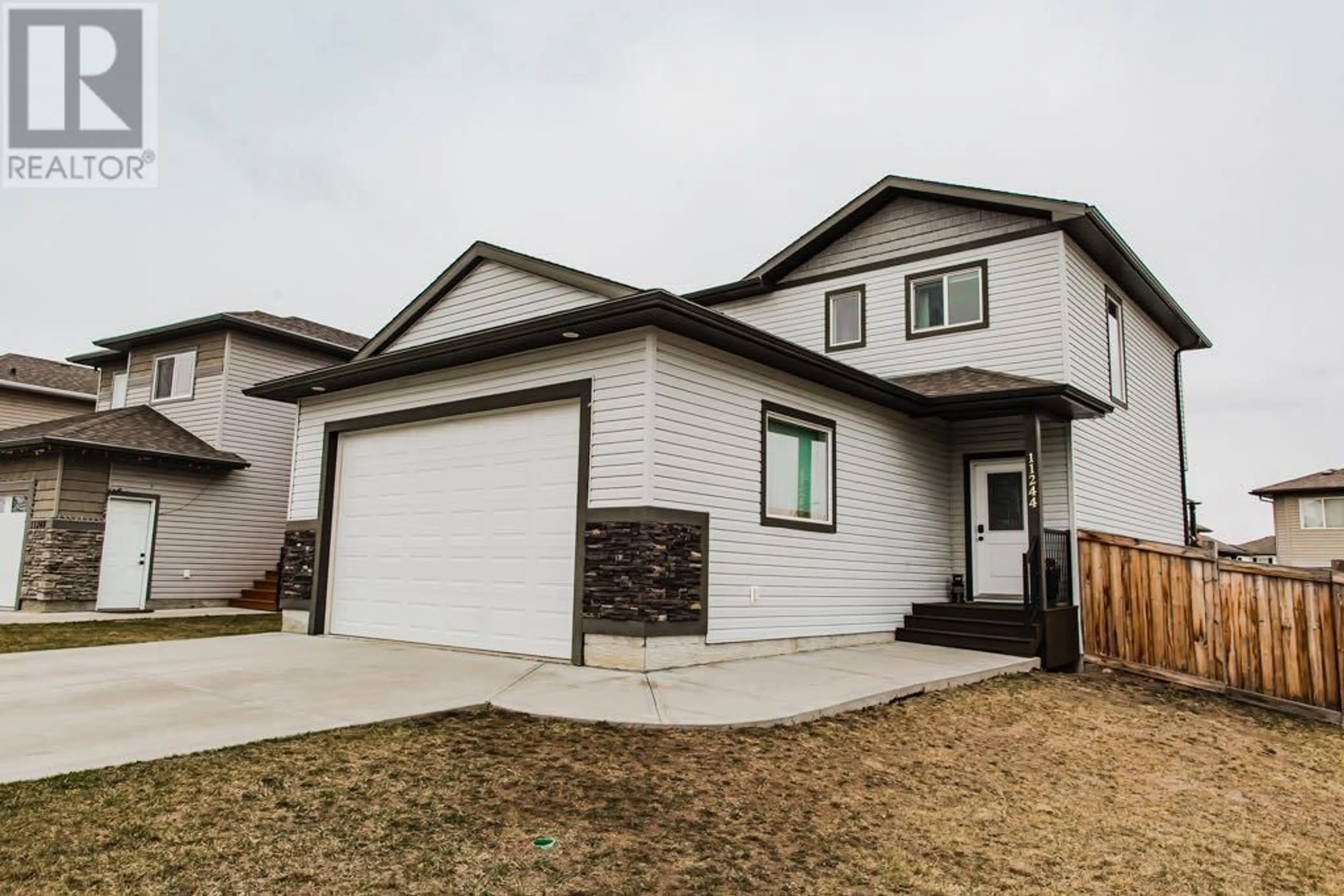 Frontside or backside of a home for 11244 80 Avenue, Grande Prairie Alberta T8W0B7