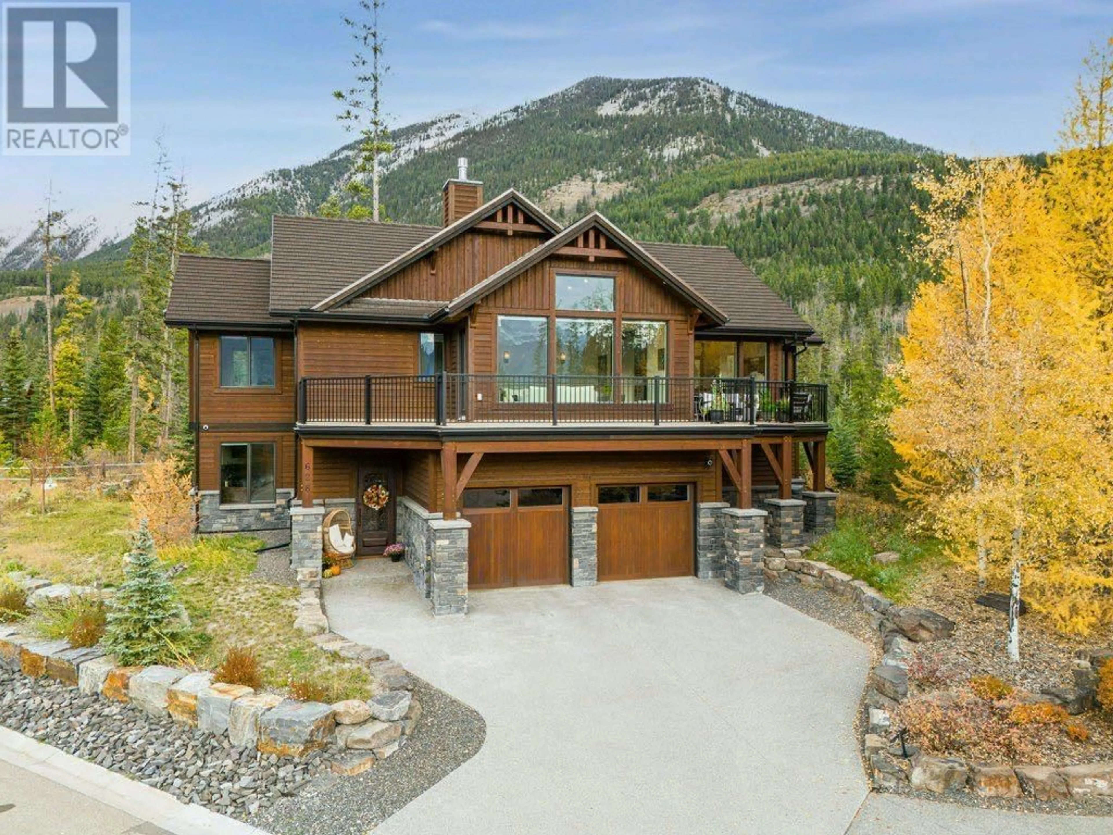 Frontside or backside of a home for 628 Silvertip Road, Canmore Alberta T1W3K8