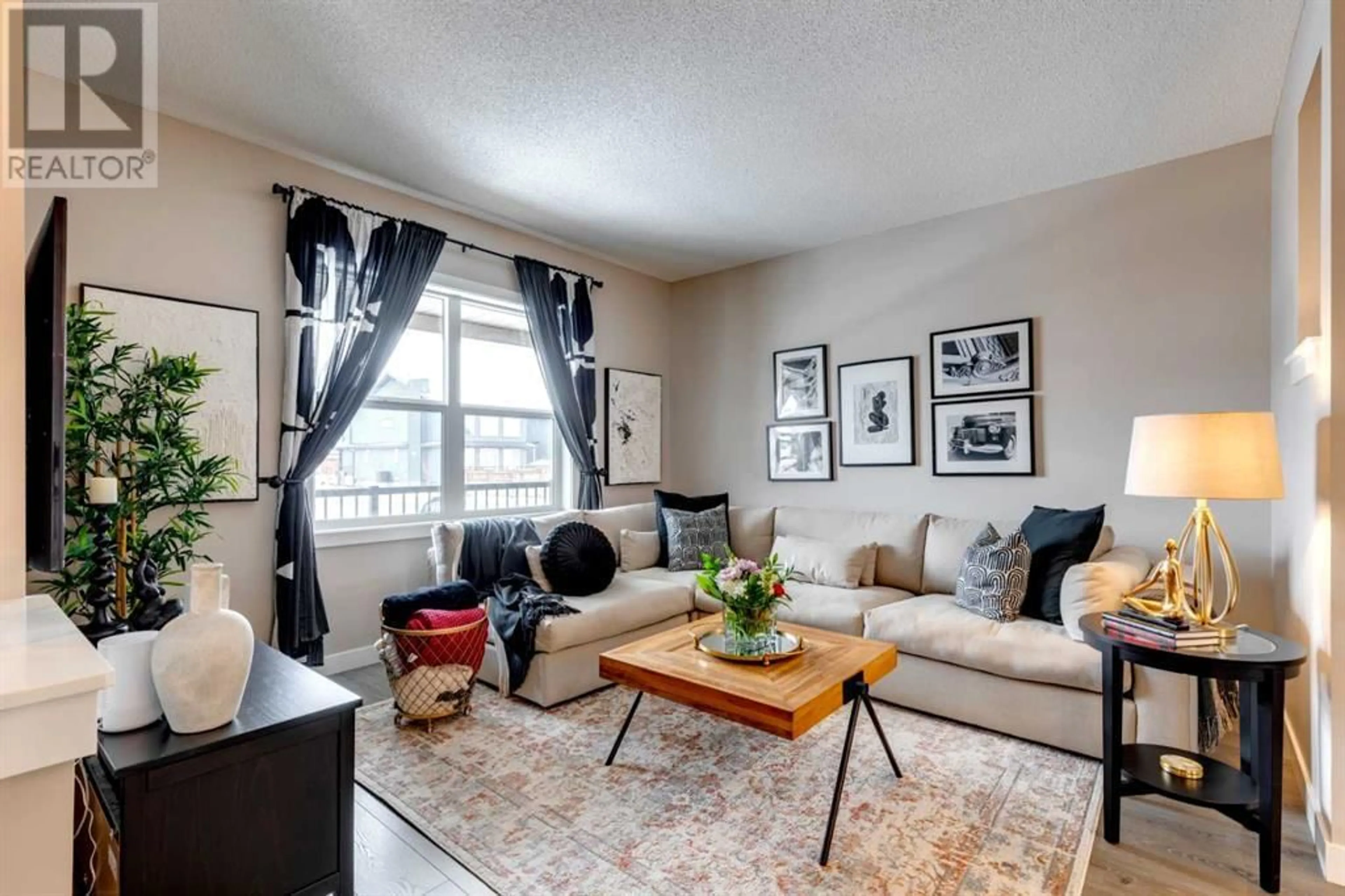 Living room for 137 Creekside Boulevard SW, Calgary Alberta T2X4H3