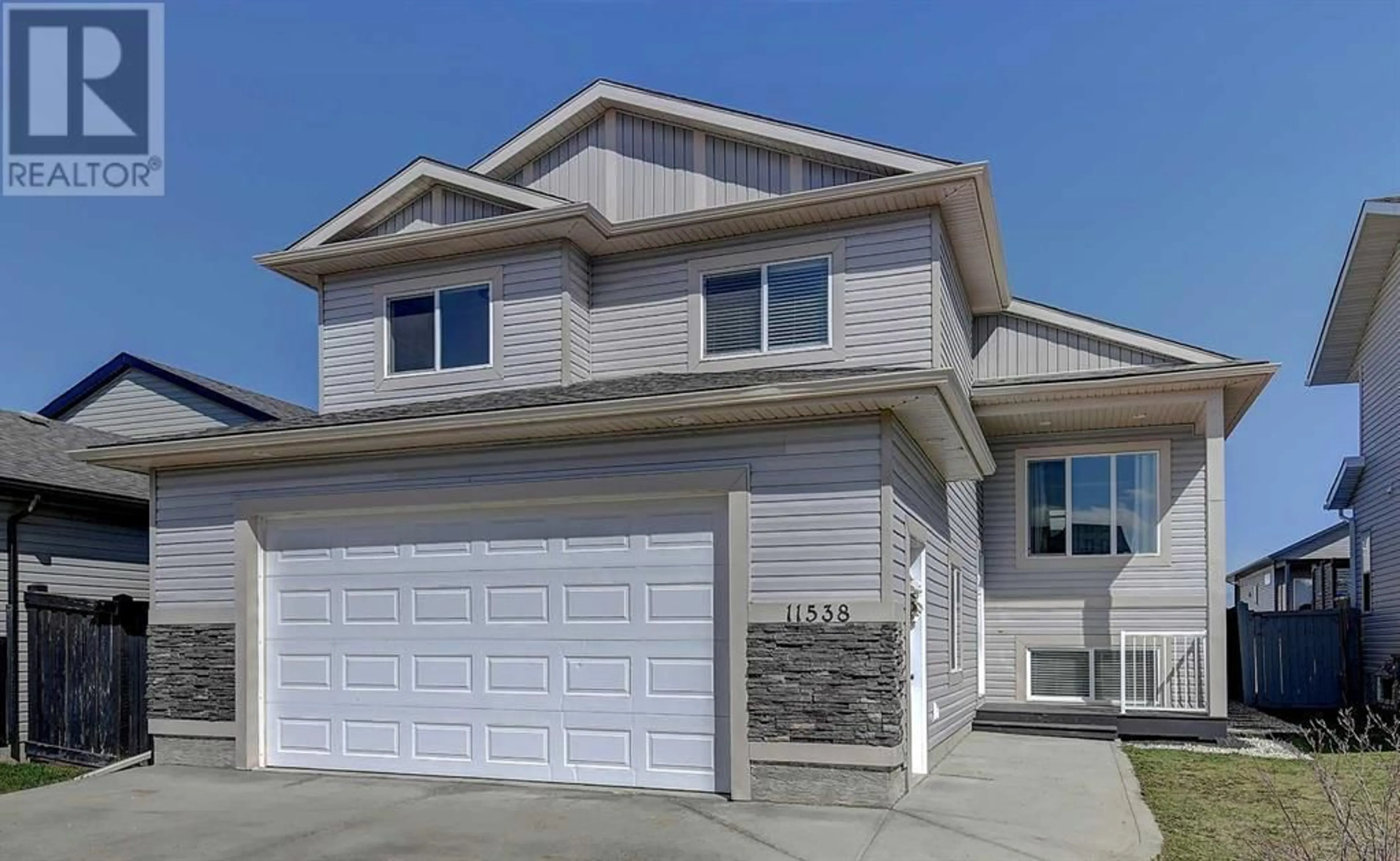 Home with vinyl exterior material for 11538 72 Avenue, Grande Prairie Alberta T8W0H9