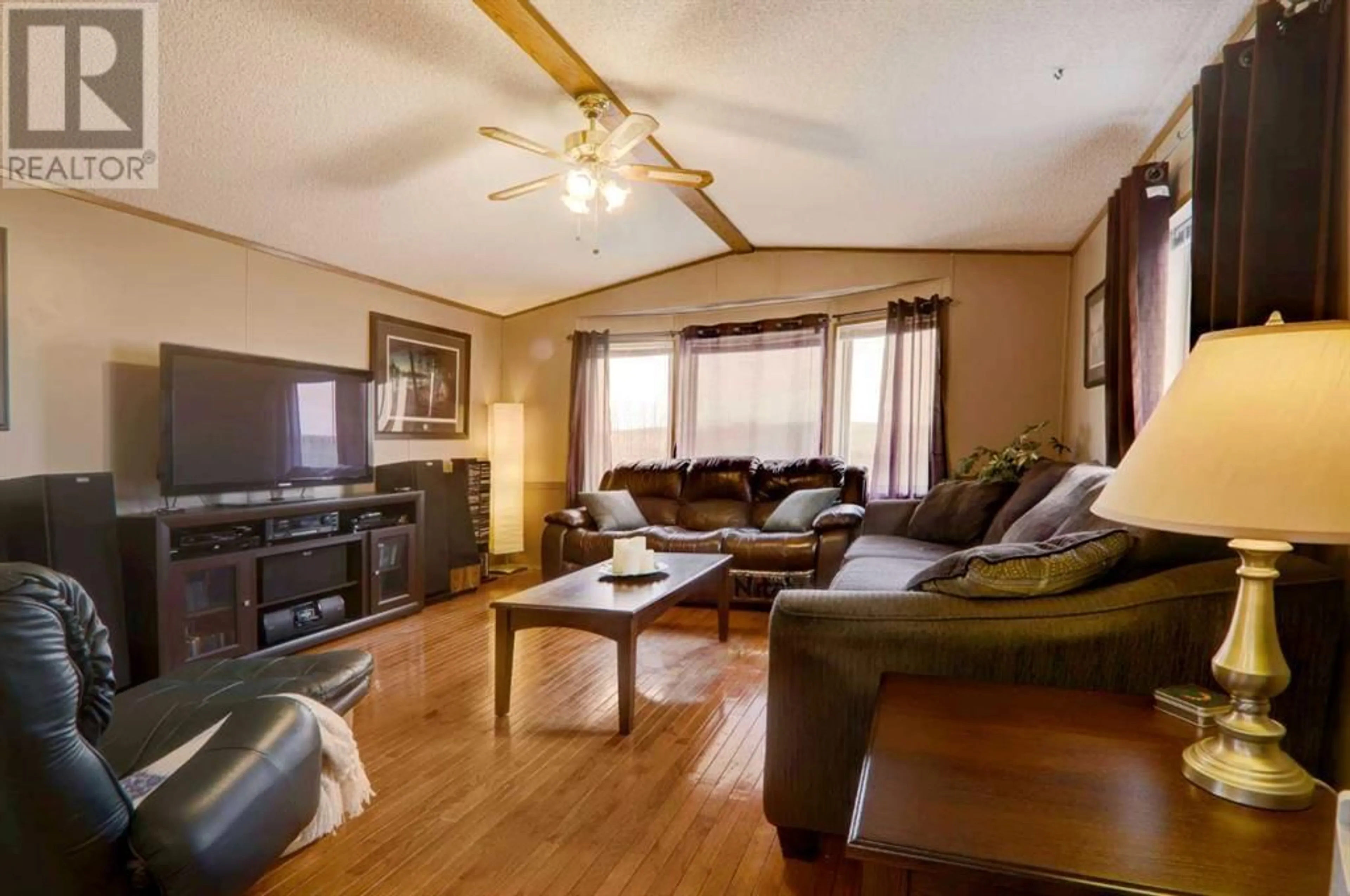 Living room for #48 110 Highway 22 North, Cremona Alberta T0M0R0
