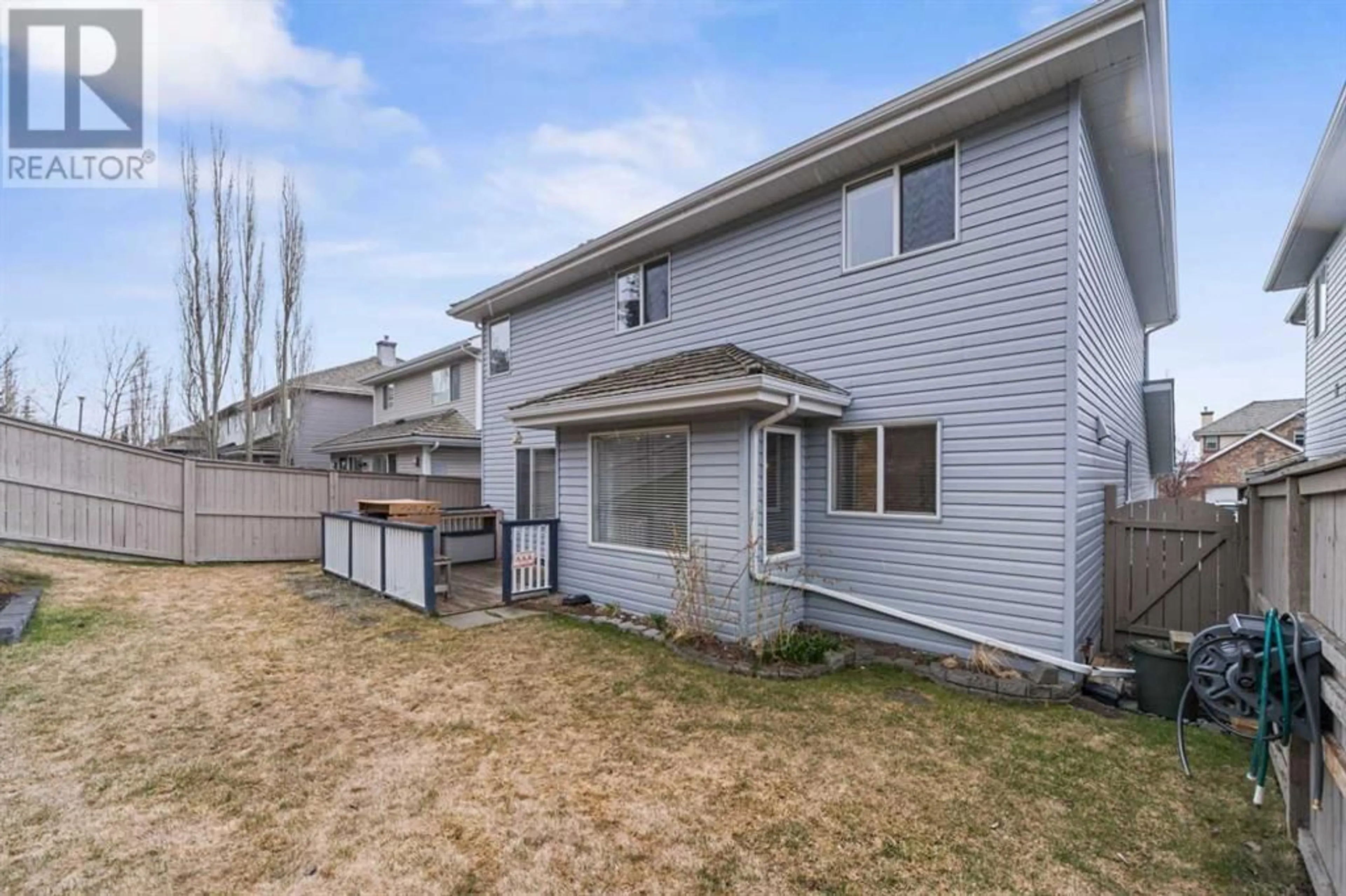 Frontside or backside of a home for 7830 Springbank Way SW, Calgary Alberta T3H4J8