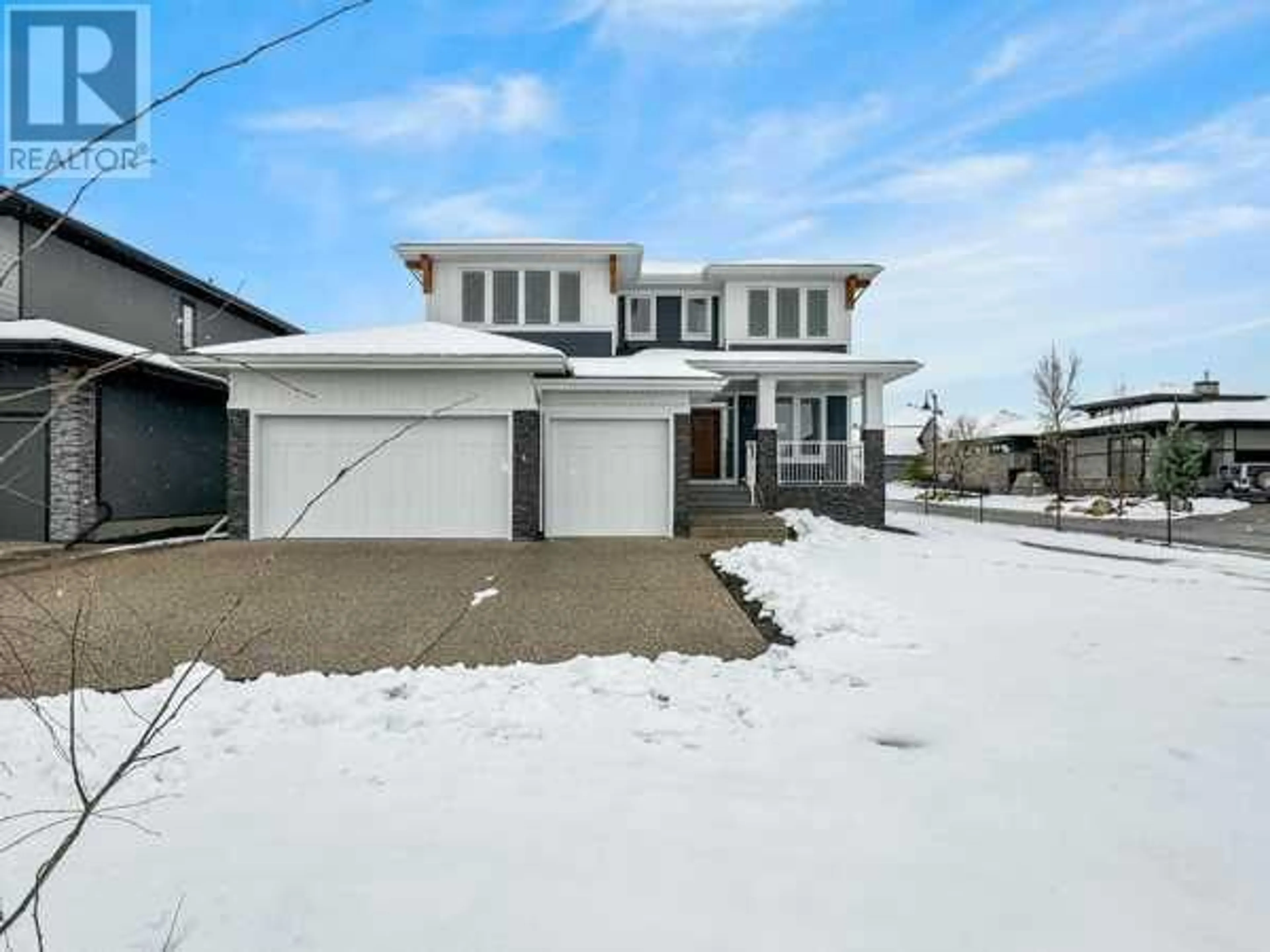 Frontside or backside of a home for 30 Willow Springs Crescent, Heritage Pointe Alberta T1S4K6