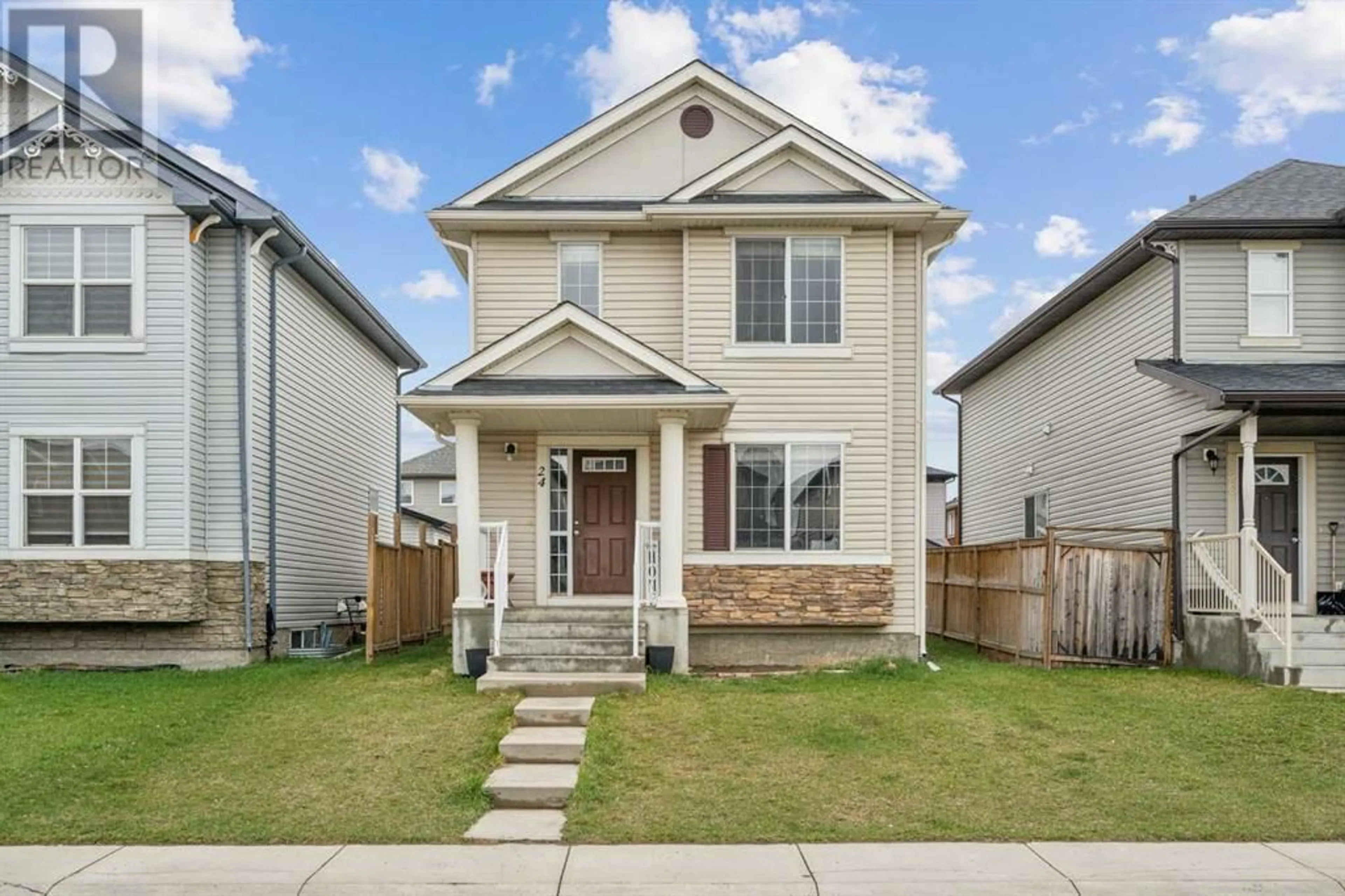Frontside or backside of a home for 24 Taralake Street NE, Calgary Alberta T3J0J4