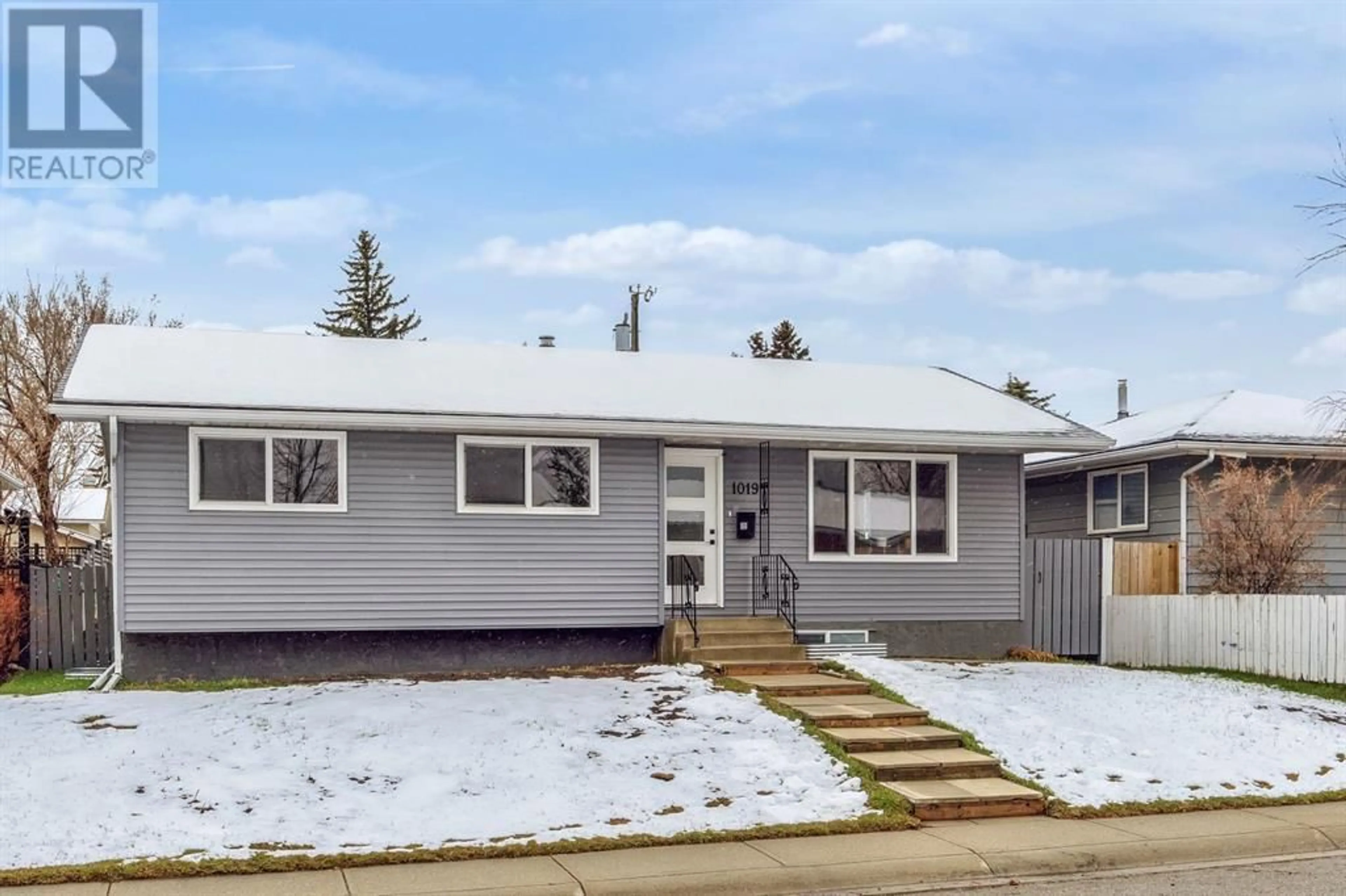 Frontside or backside of a home for 1019 Penmeadows Road SE, Calgary Alberta T2A3R3