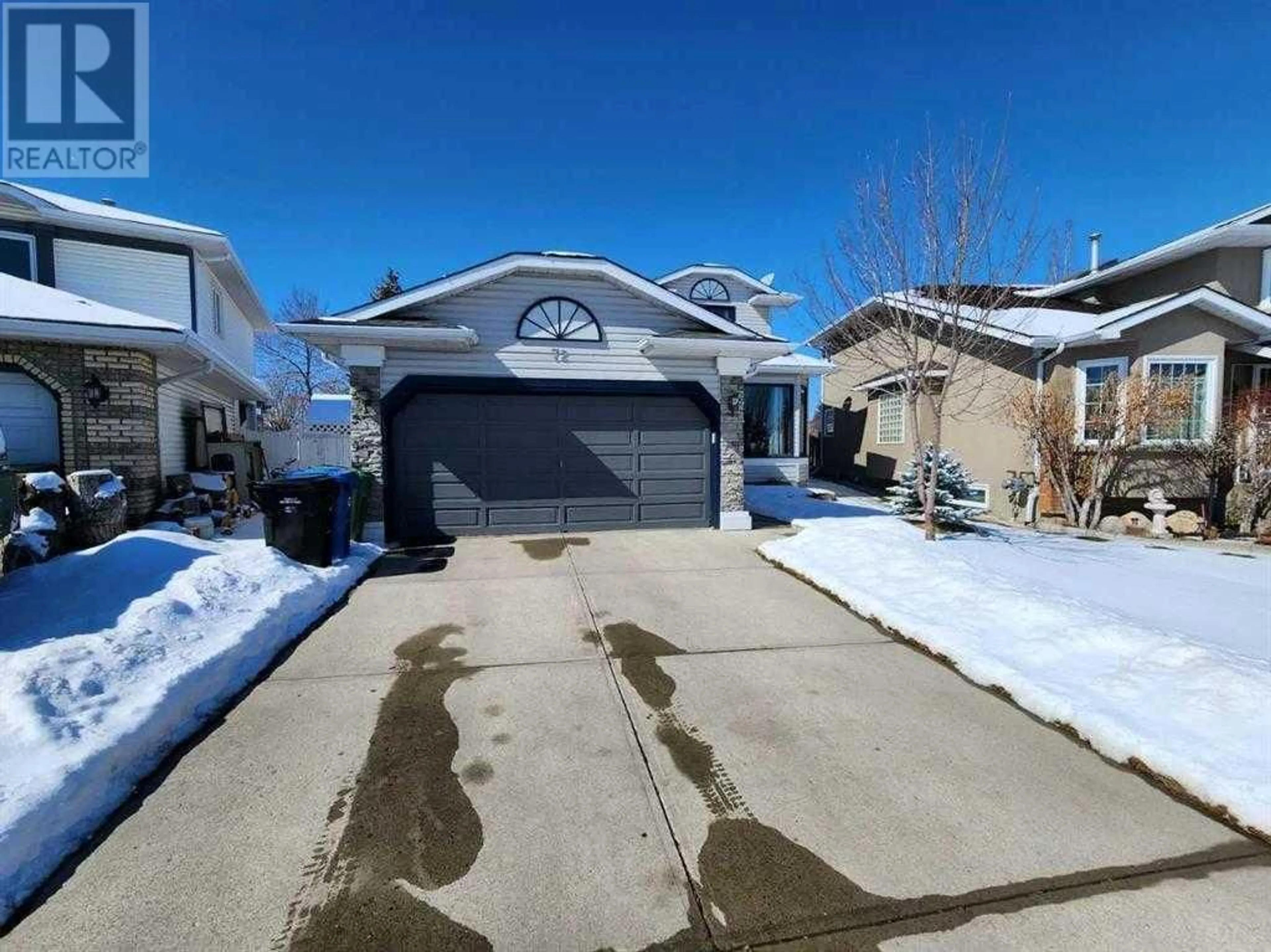Frontside or backside of a home for 72 Hidden Vale Close NW, Calgary Alberta T3A5C8