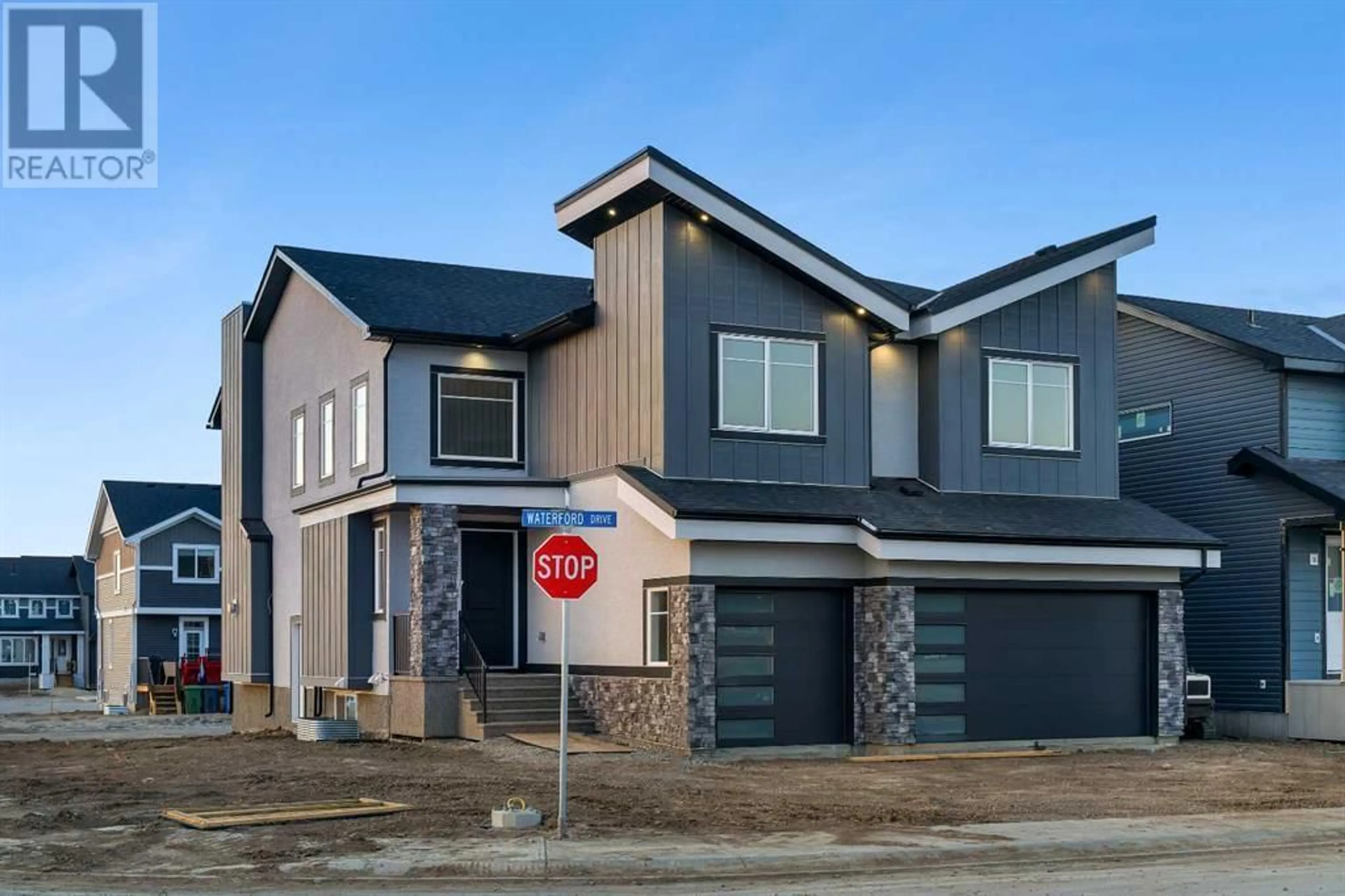 Frontside or backside of a home for 208 Waterford Heath, Chestermere Alberta T1X0B3