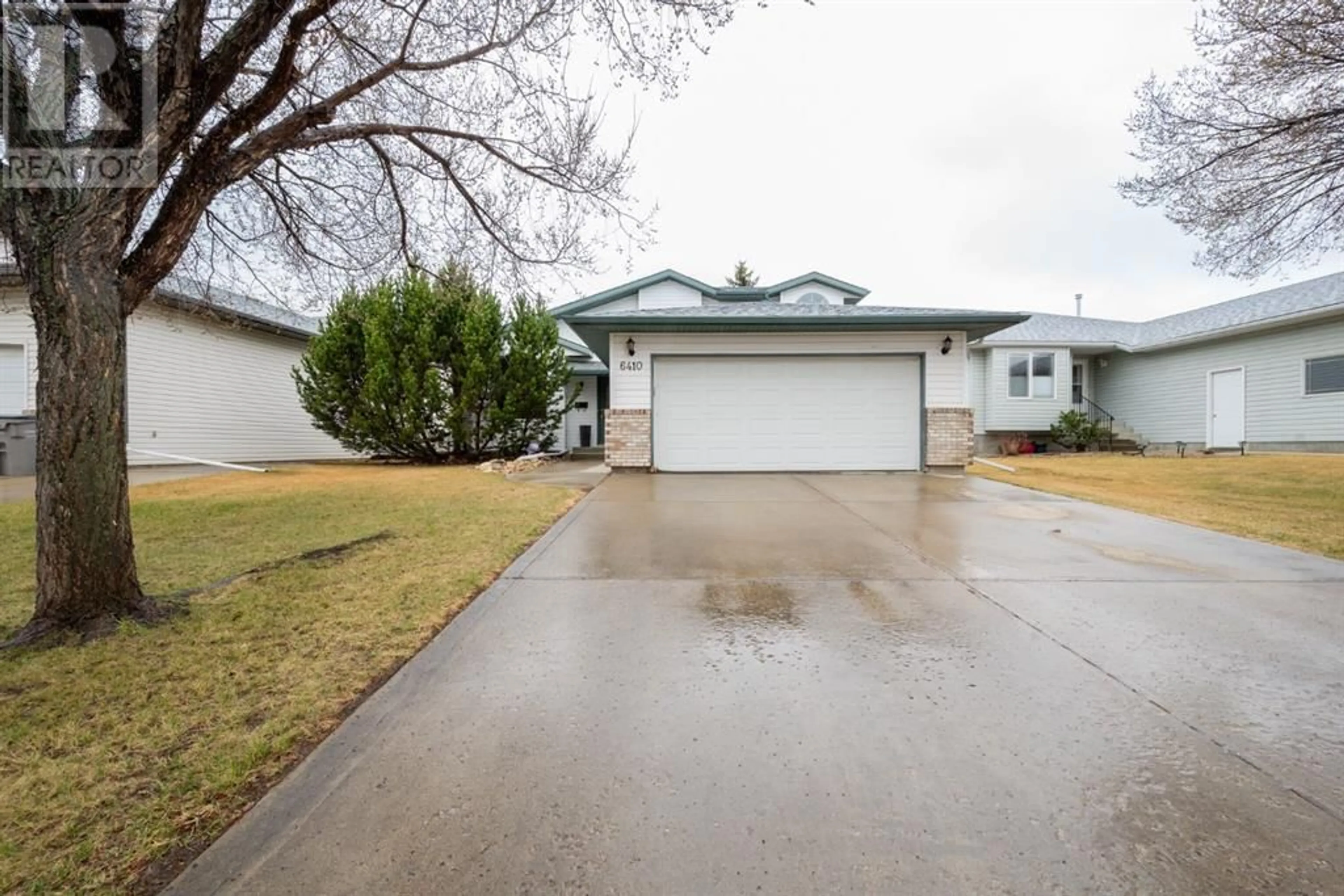 Frontside or backside of a home for 6410 99 Street, Grande Prairie Alberta T8W2K6