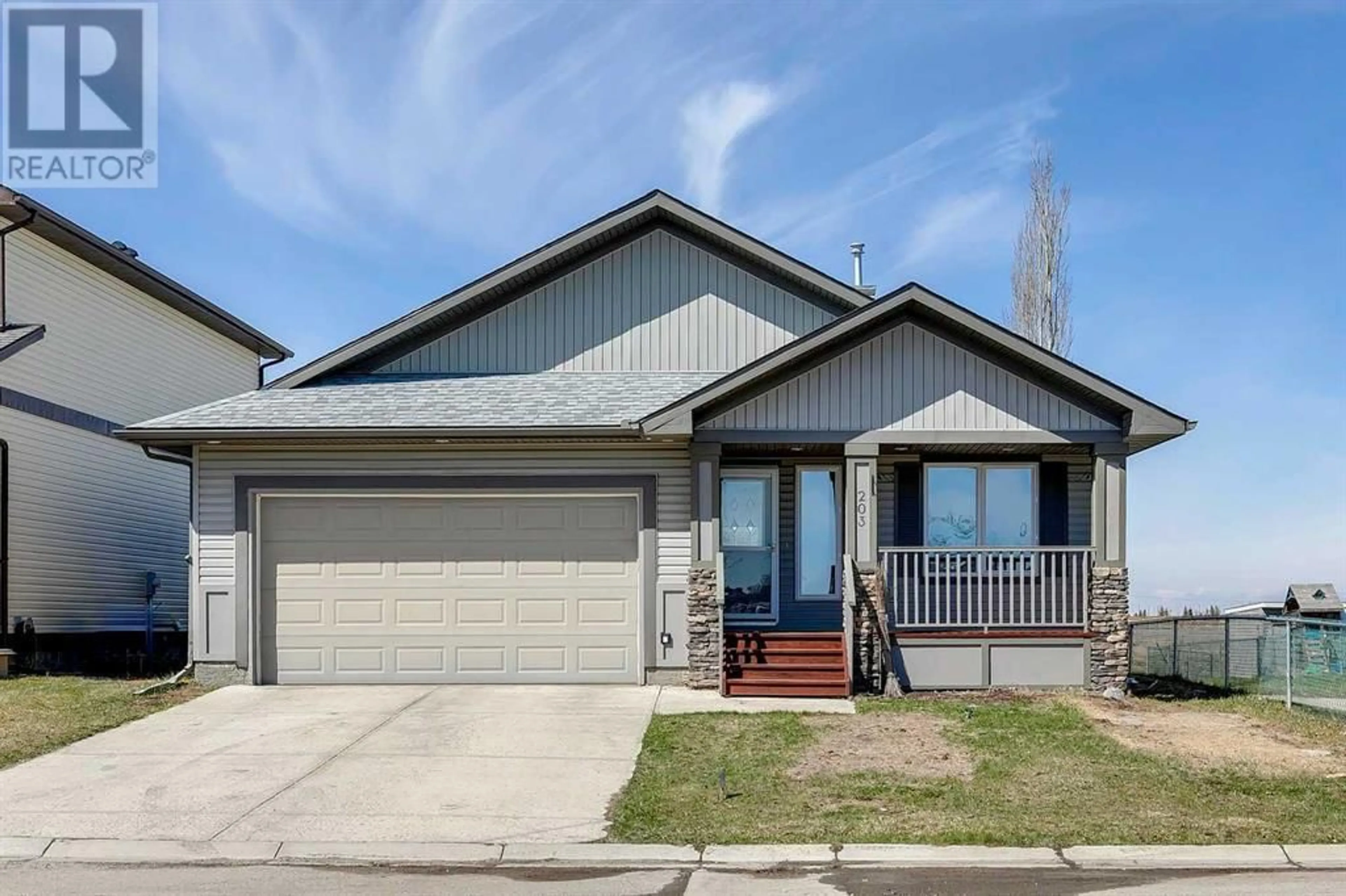 Frontside or backside of a home for 203 Bishop Mews NW, Langdon Alberta T0J1X2