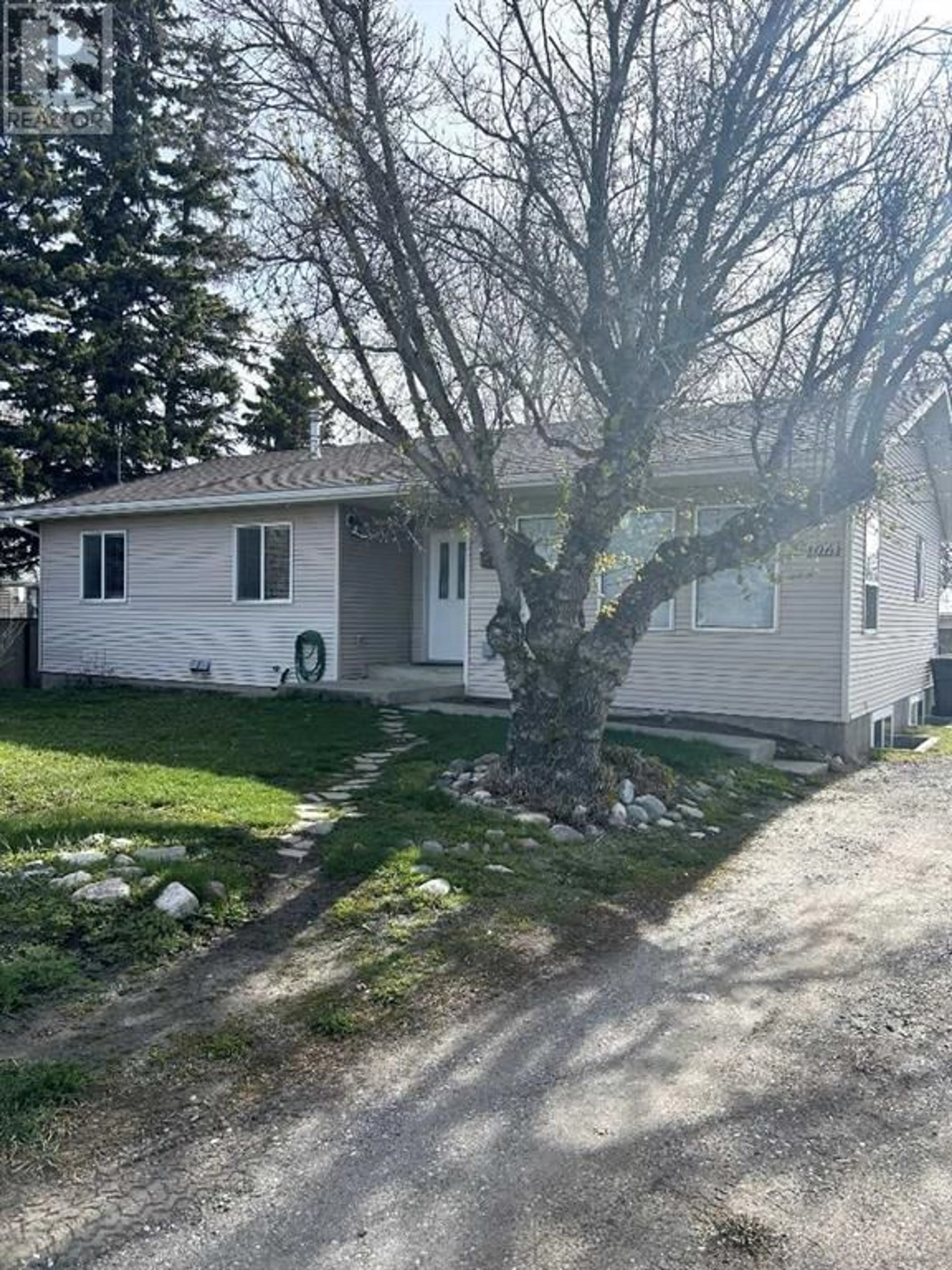 Frontside or backside of a home for 1061 Beverly McLachlin Drive, Pincher Creek Alberta T0K1W0