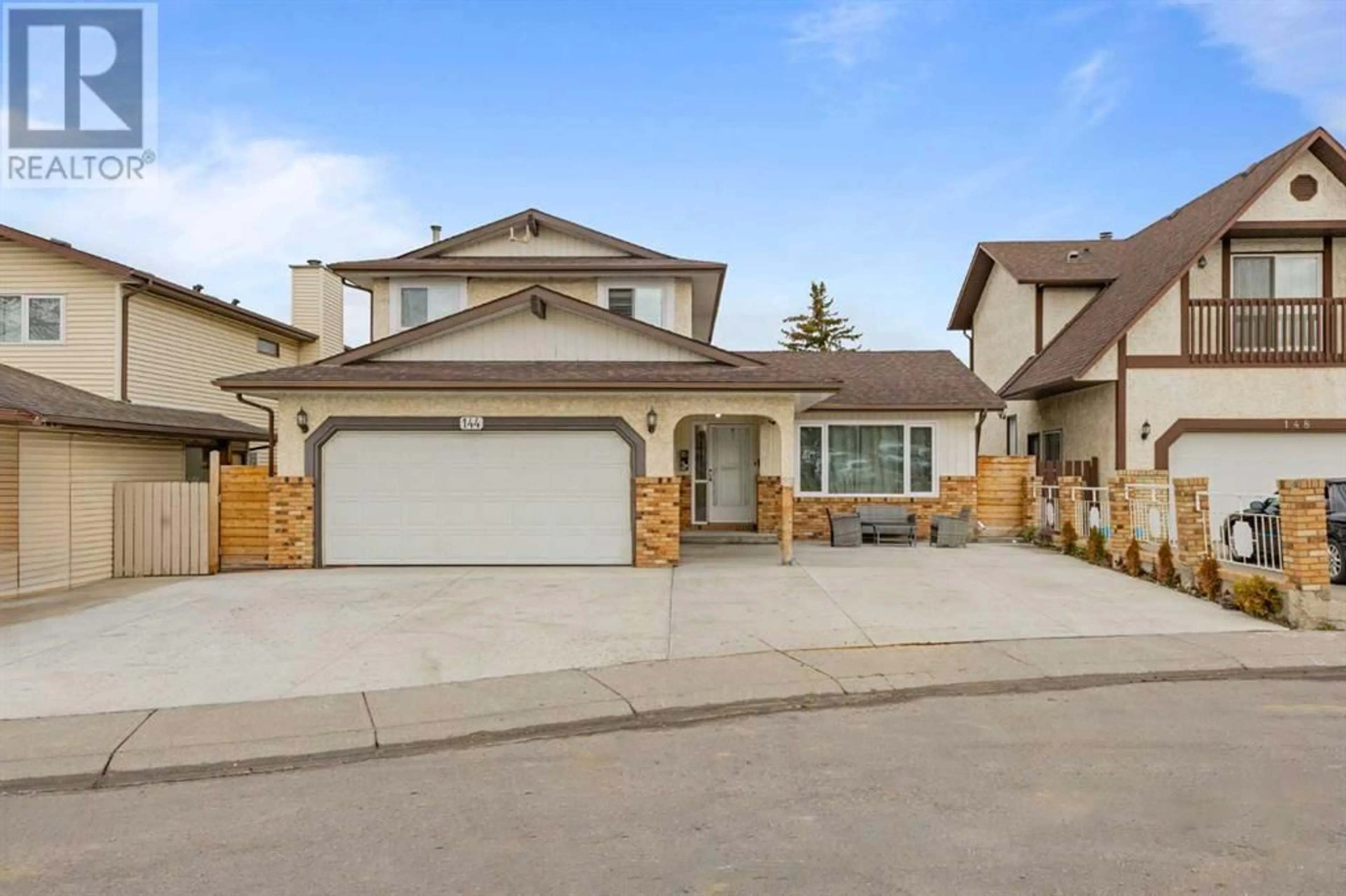 Frontside or backside of a home for 144 Whitlow Place NE, Calgary Alberta T1Y6J9