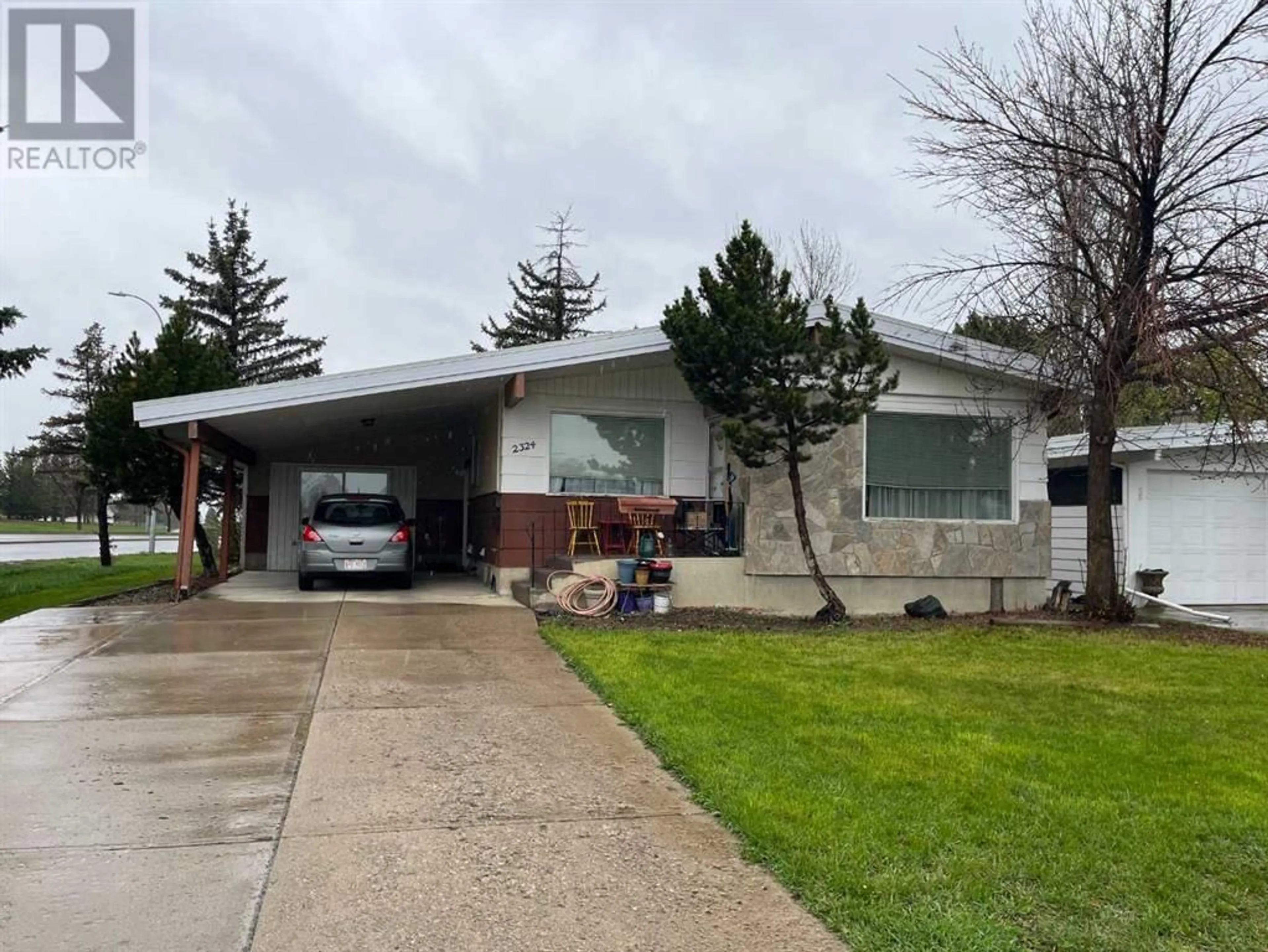 Frontside or backside of a home for 2324 20 Street S, Lethbridge Alberta T1K2G9