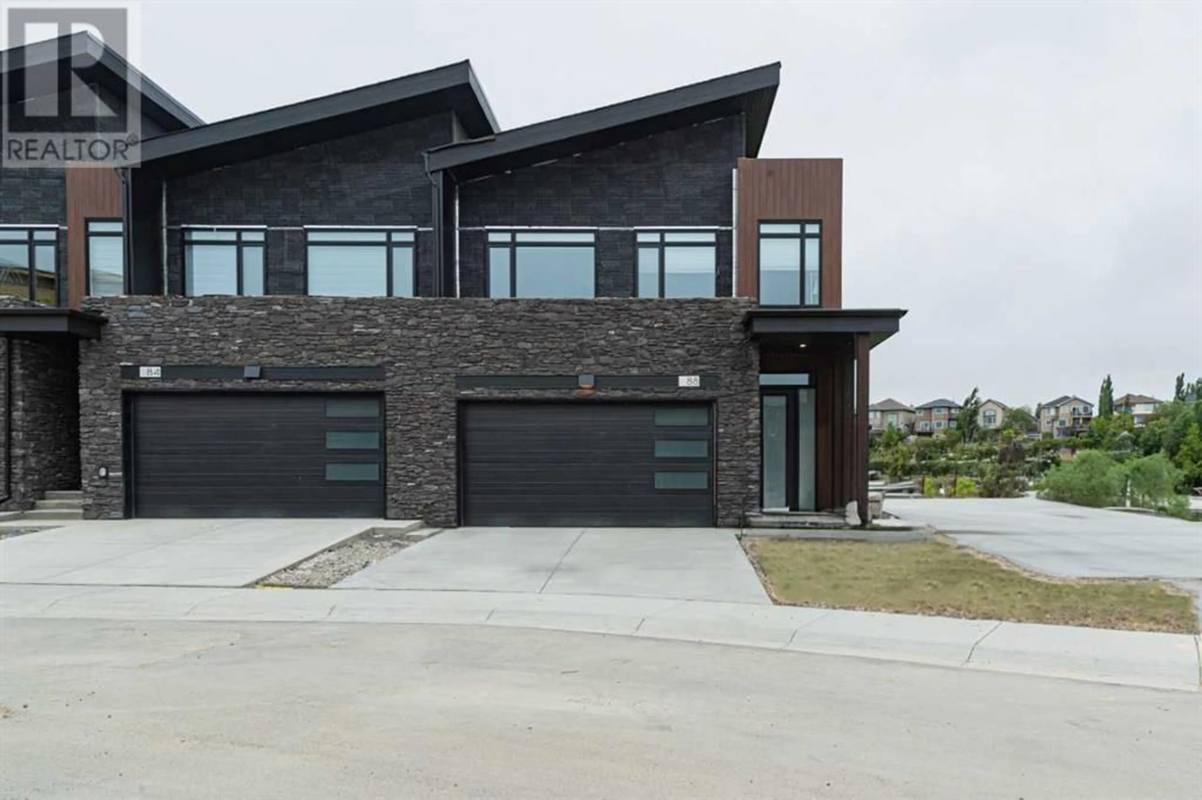 Frontside or backside of a home for 102 Royal Elm Green NW, Calgary Alberta T3G0G8