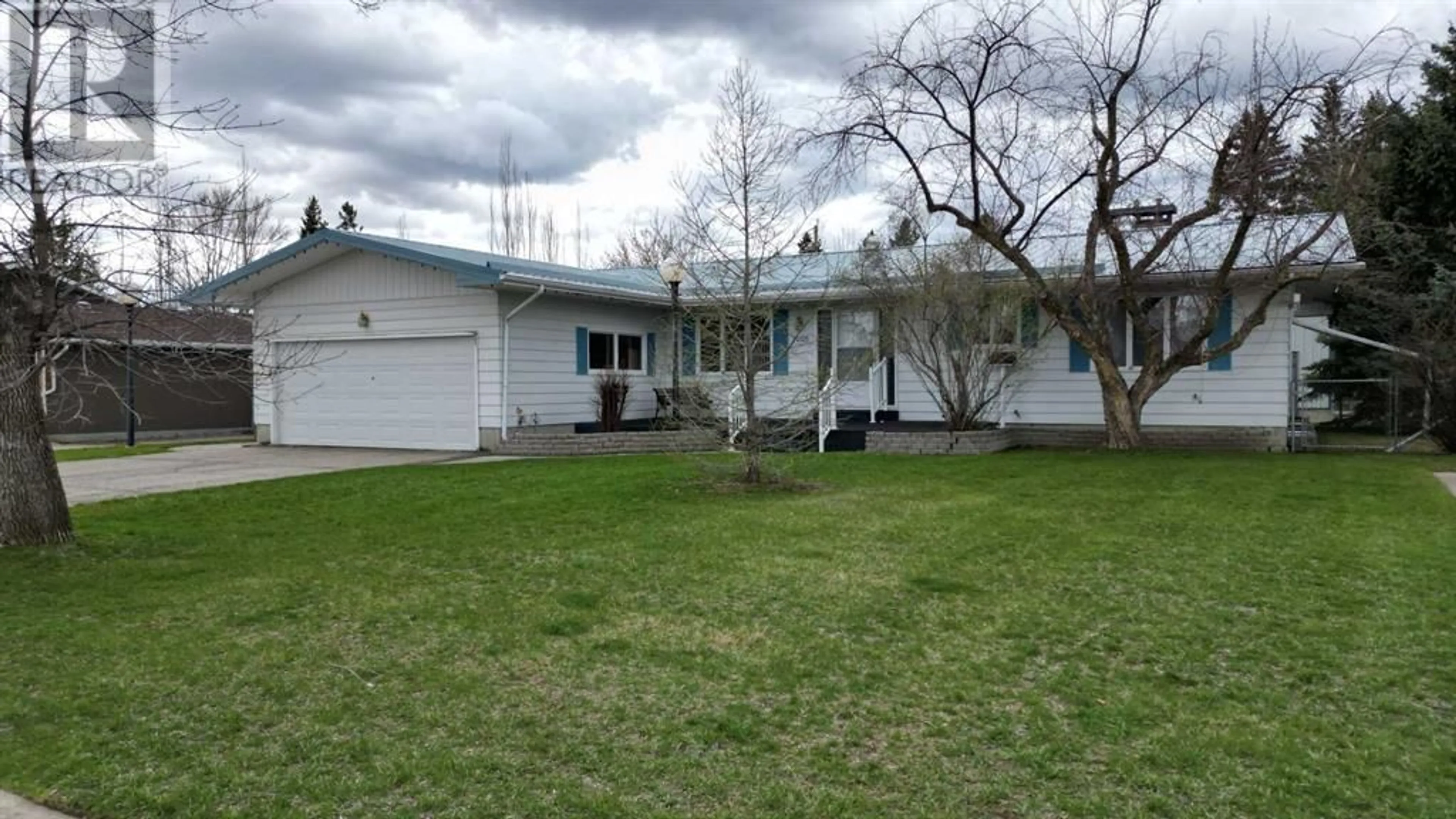 Frontside or backside of a home for 1005 8 Street SW, High River Alberta T1V1A9
