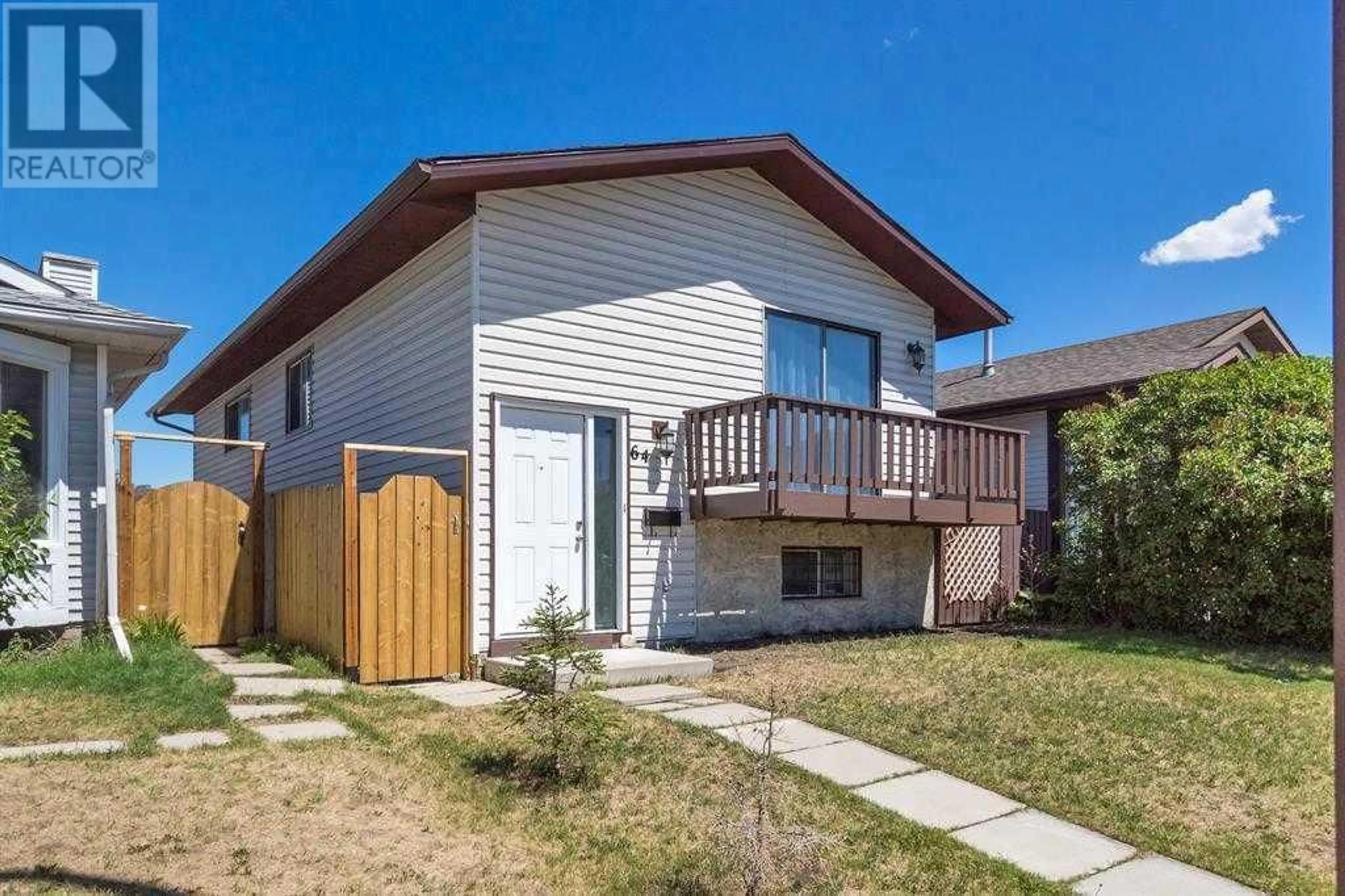 Frontside or backside of a home for 64 Whitworth Road NE, Calgary Alberta T1Y6E1