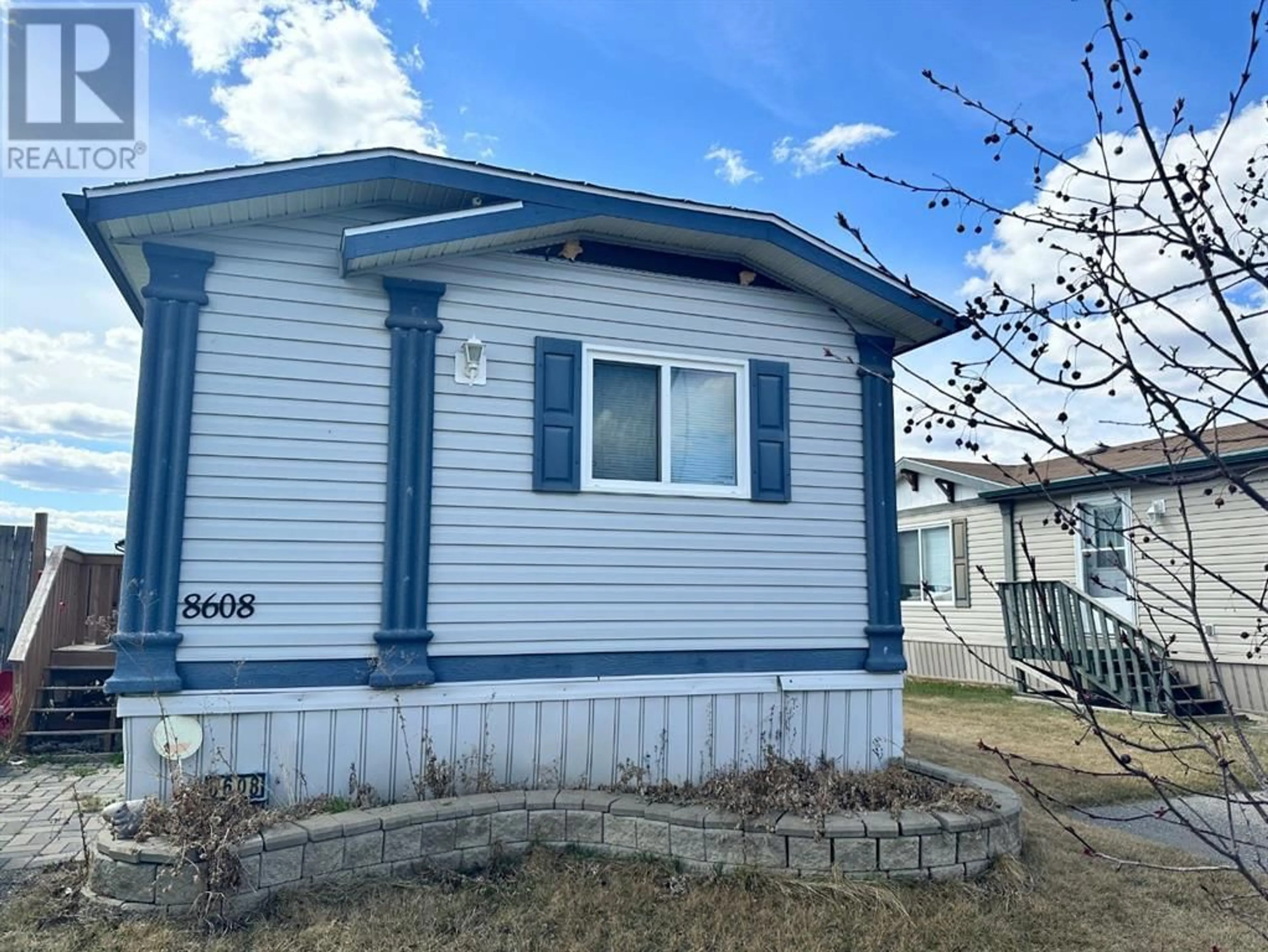 Home with vinyl exterior material for 8608 89 Street, Grande Prairie Alberta T8X1V7