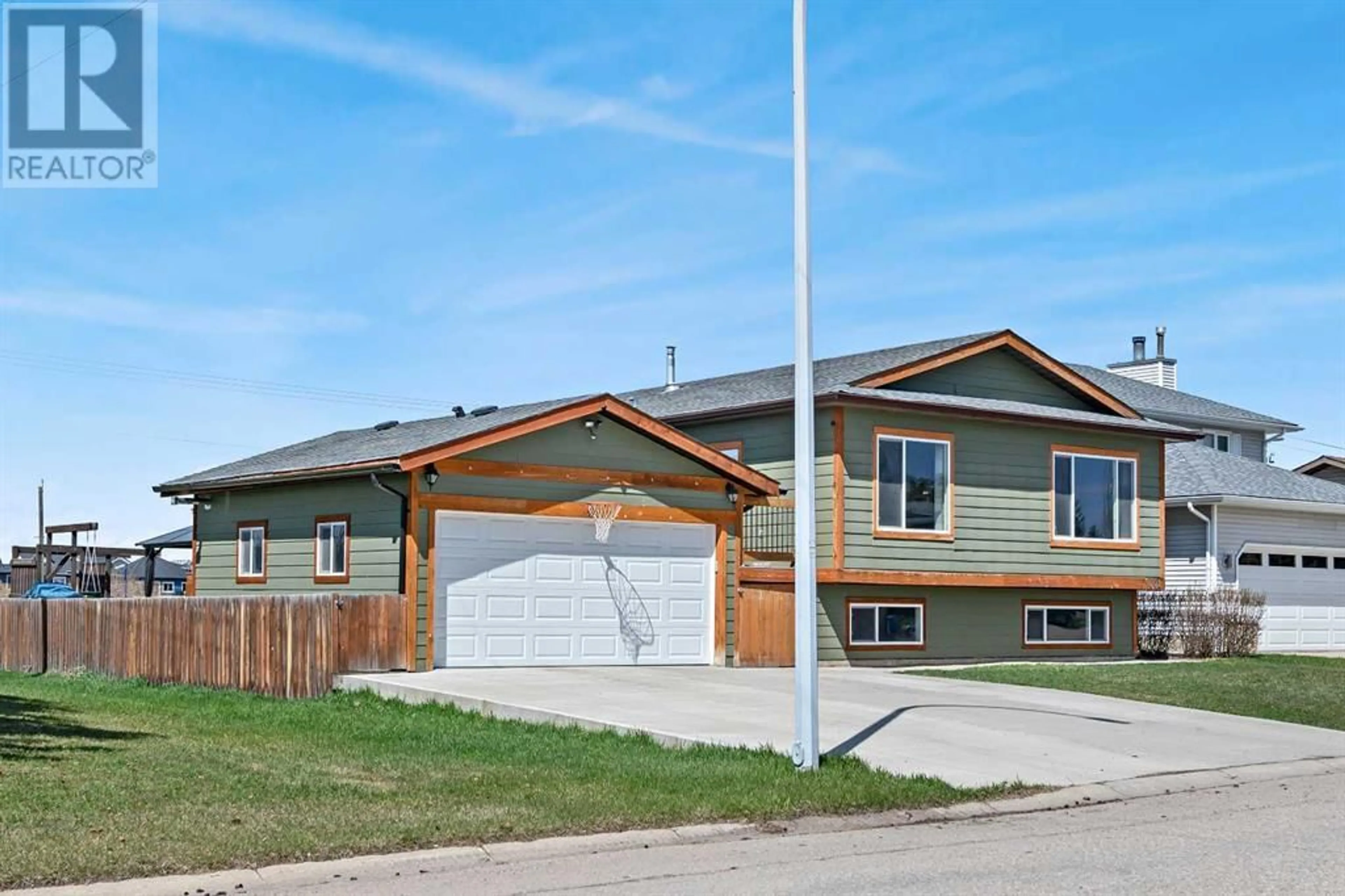 Frontside or backside of a home for 1602 Harrison Street, Crossfield Alberta T0M0S0
