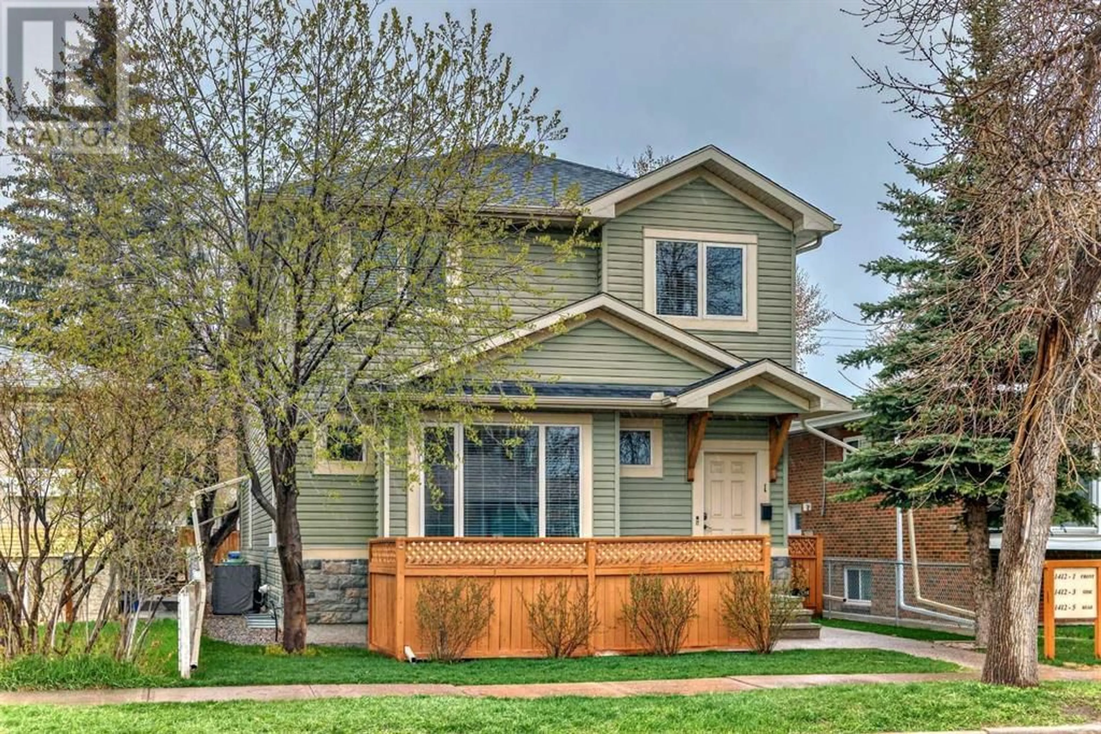 Frontside or backside of a home for 1 1412 20 Avenue NW, Calgary Alberta T2M1G5