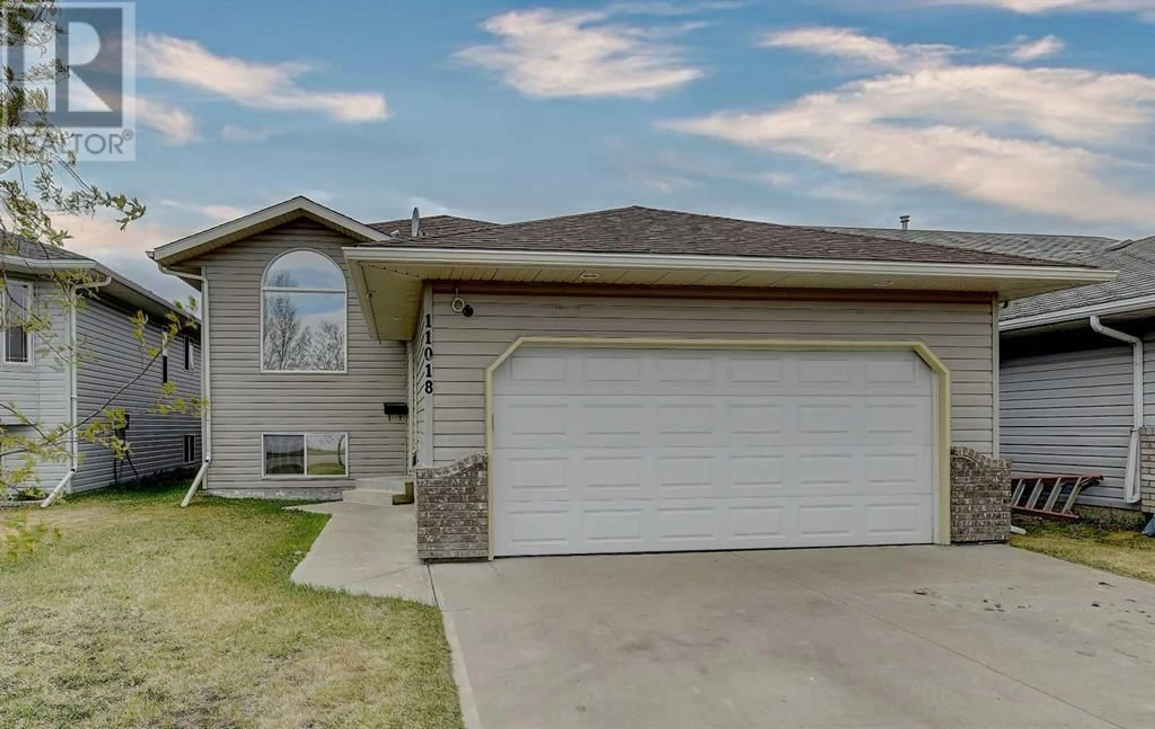 Frontside or backside of a home for 11018 88A Street, Grande Prairie Alberta T8X1P9