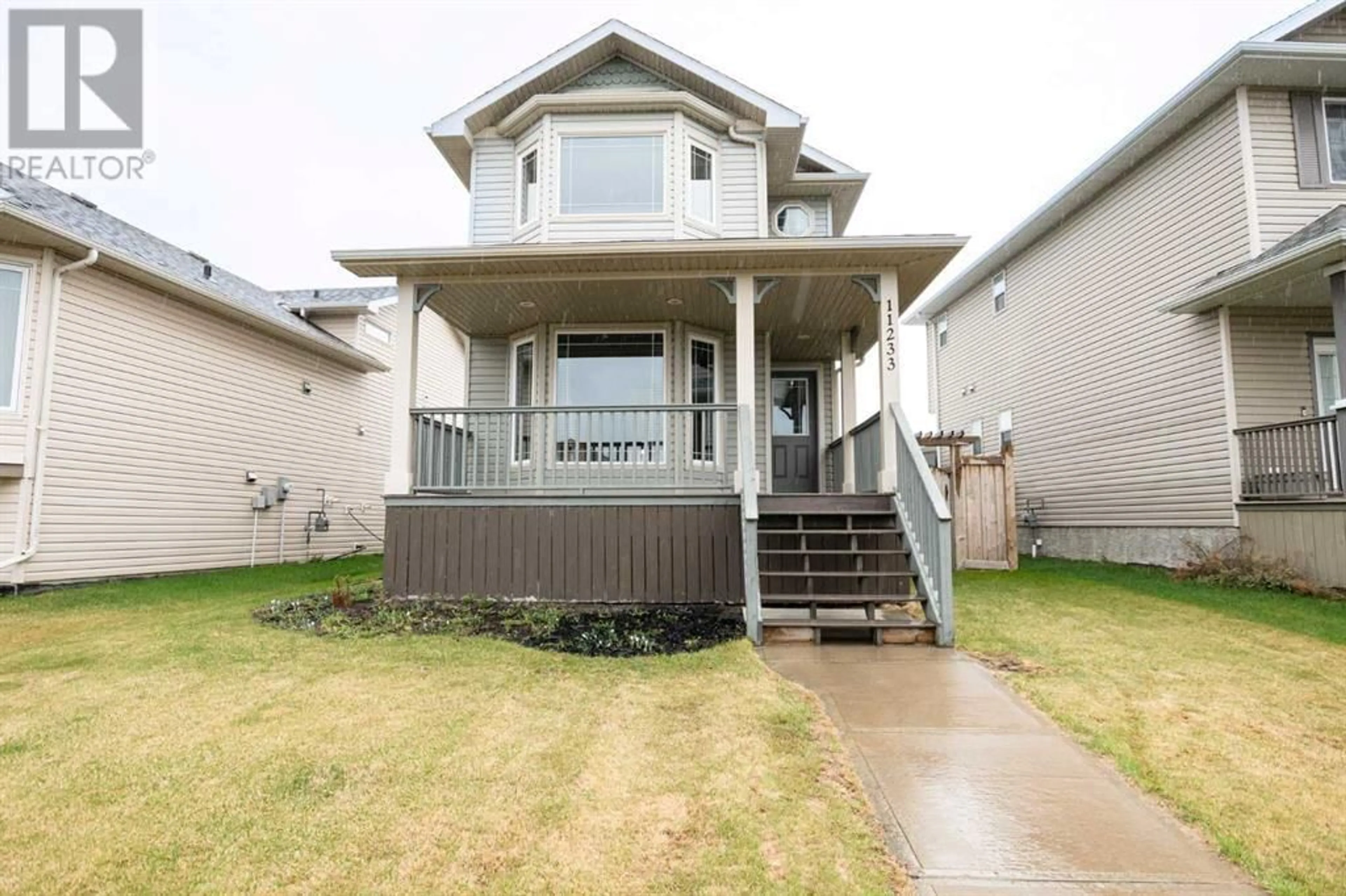 Frontside or backside of a home for 11233 75 Avenue, Grande Prairie Alberta T8W0C5